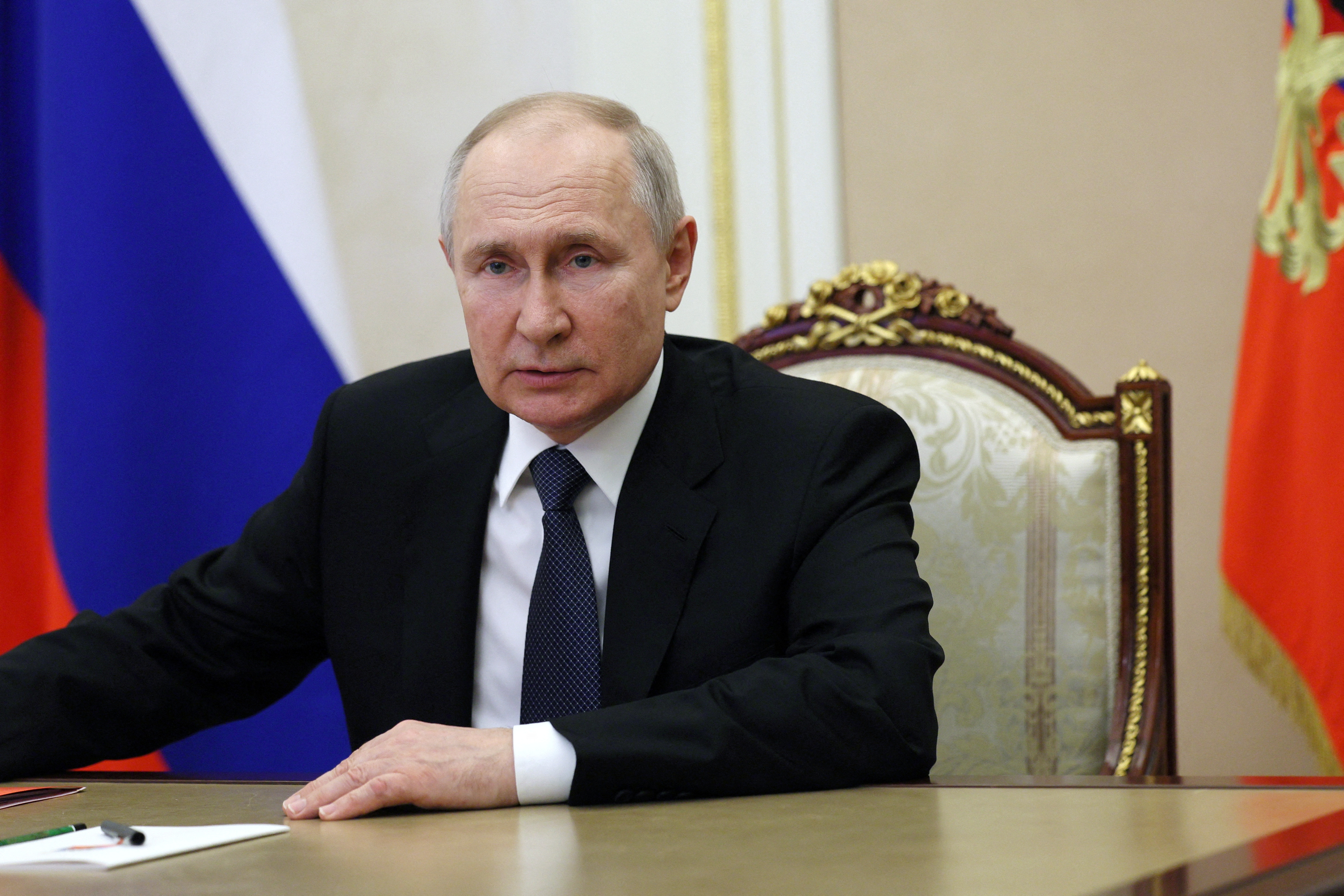 Russian President Vladimir Putin chairs a Security Council meeting in Moscow