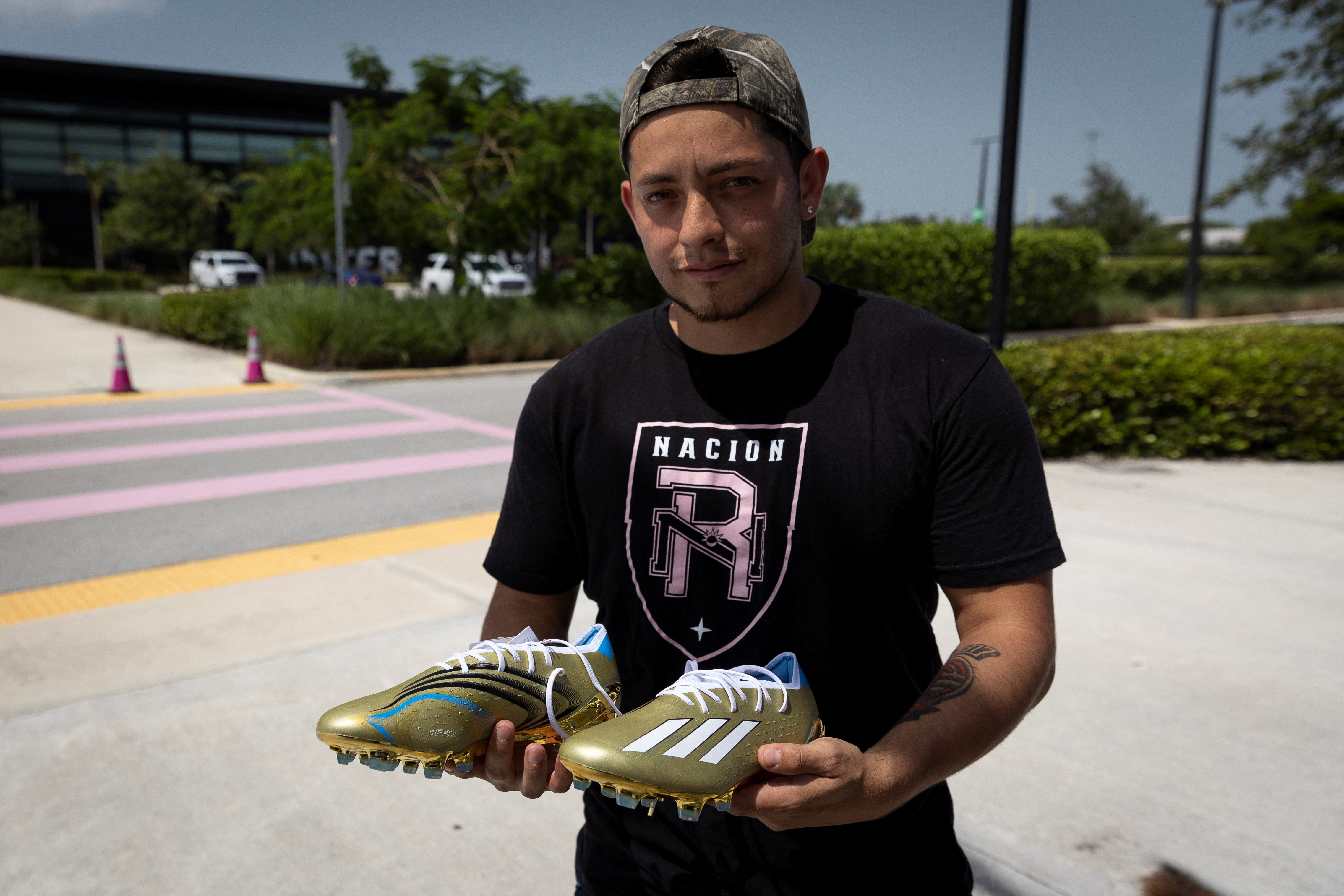 Supporters of Argentinian soccer player Leo Messi gather outside the Inter Miami DRV Pnk Stadium, in Fort Lauderdale