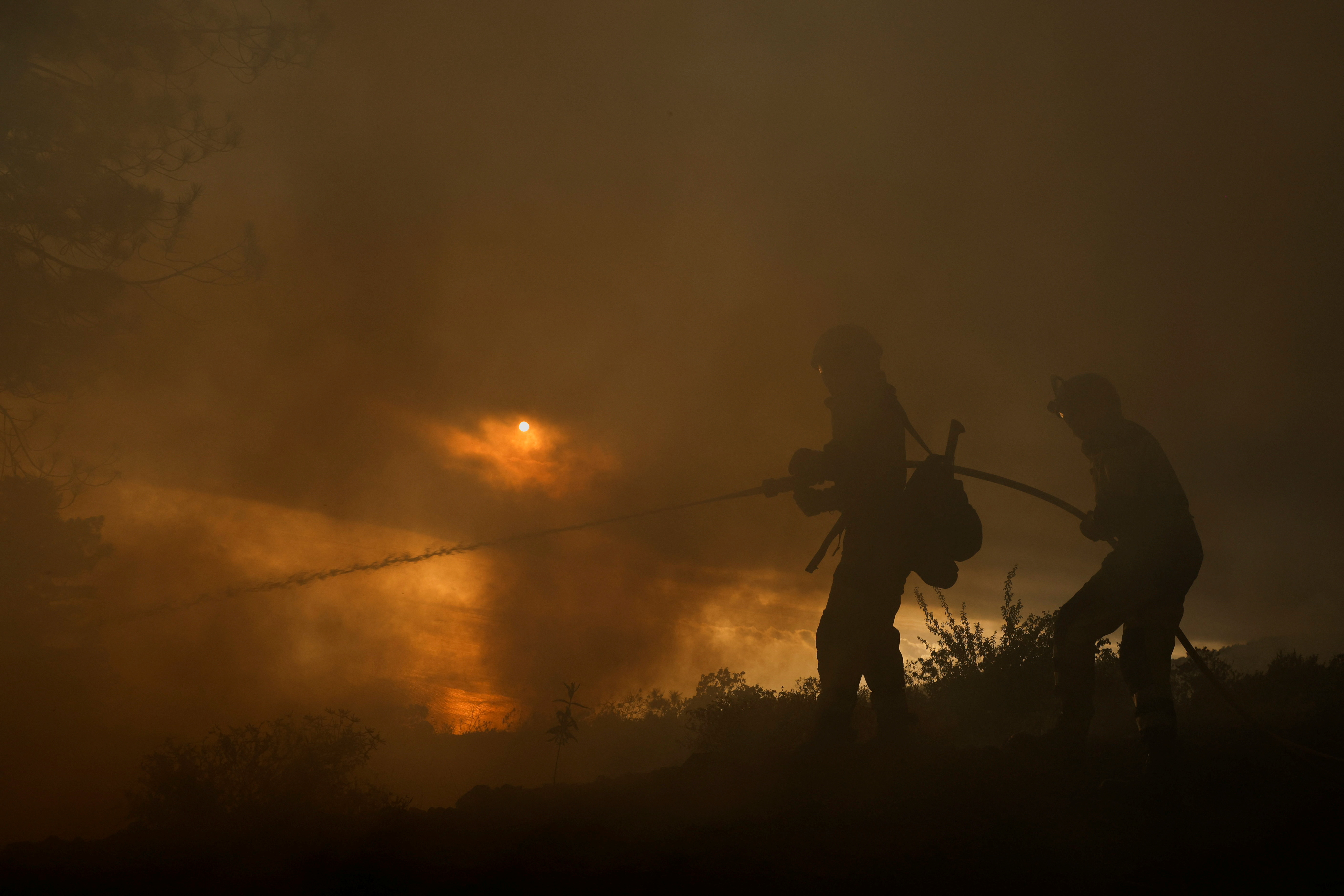 EIRIF forest firefighters work during the extinction of the Tijarafe fire on the Canary Island of La Palma
