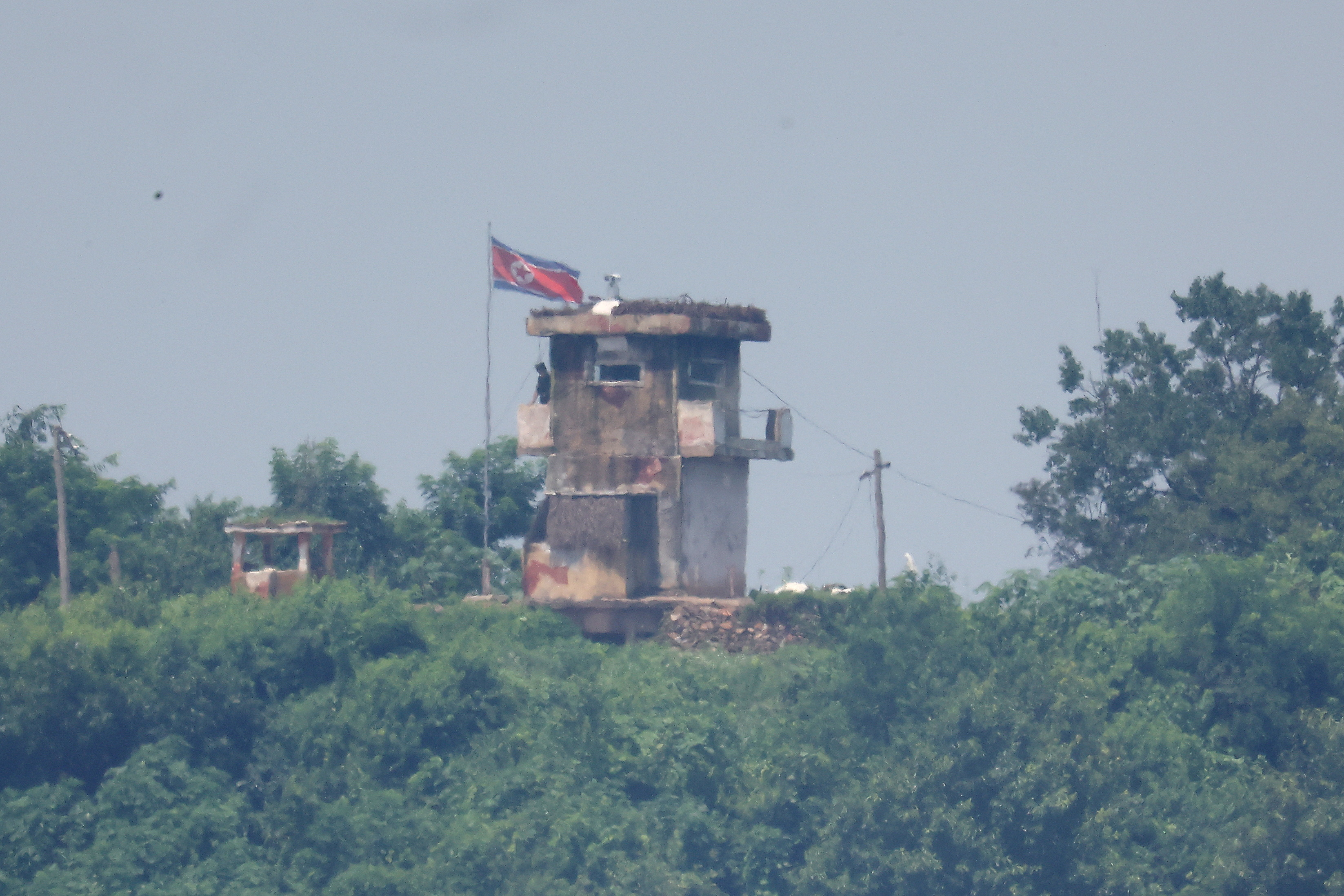 A North Korean soldier stands guard at their guard post in this picture taken near the demilitarized zone separating the two Koreas, in Paju