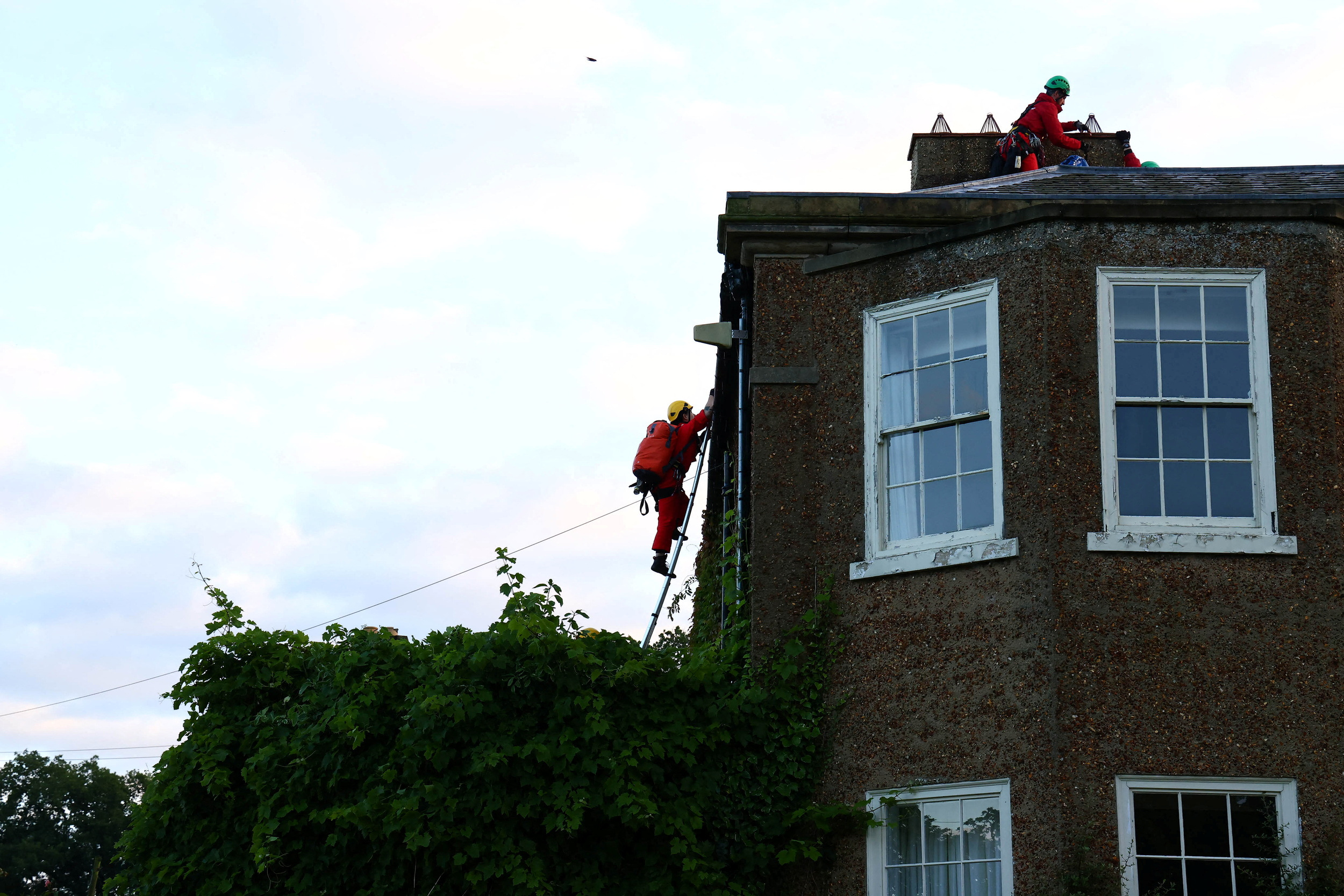 Greenpeace activists cover Rishi Sunak's mansion in oil-black fabric, in Yorkshire