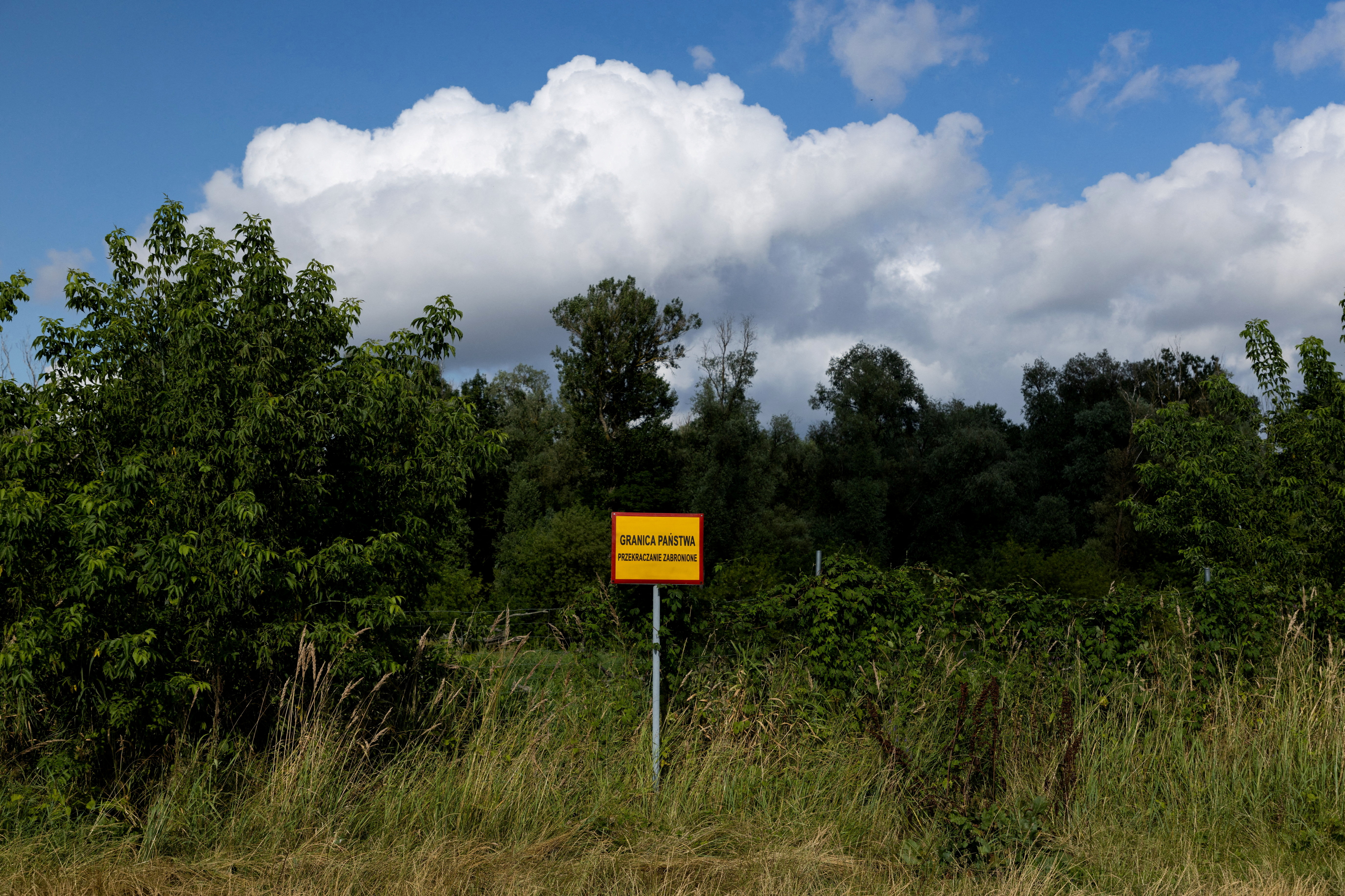 FILE PHOTO: A view across Bug River towards the Poland-Belarus border, near Kostomloty