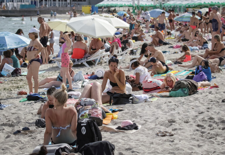 People rest at a Black Sea beach in Odesa