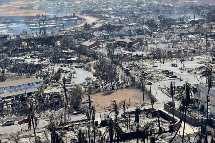 The shells of burned houses and buildings are left after wildfires in Lahaina