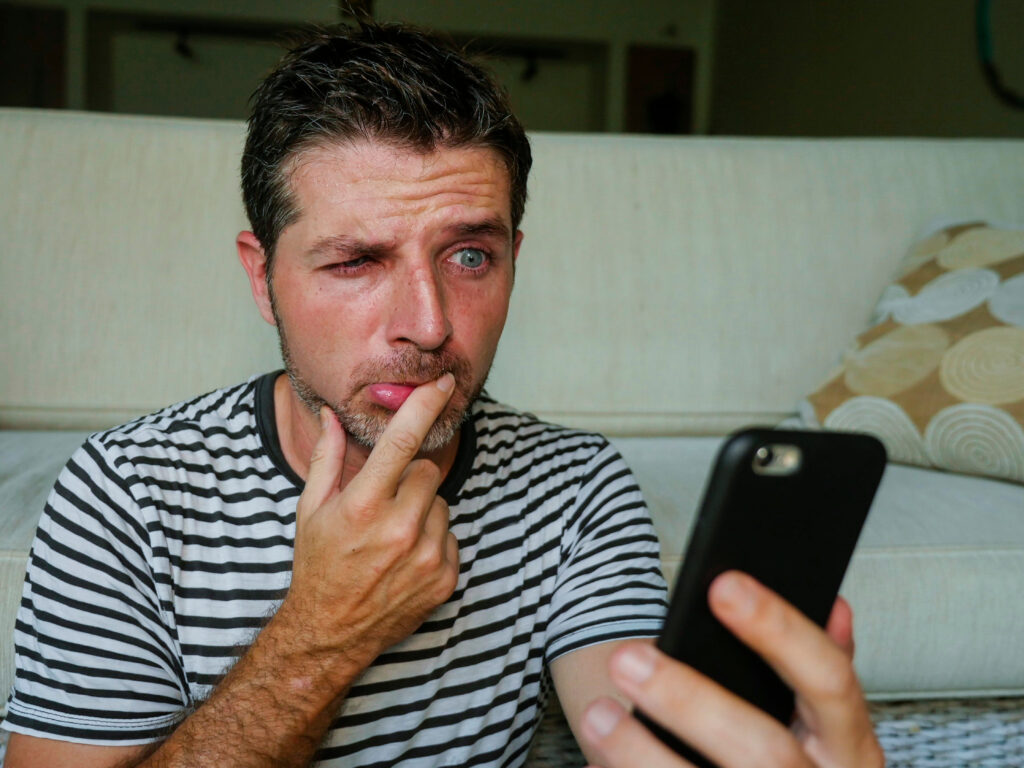 Lifestyle,Portrait,Of,Young,Confused,And,Stressed,Hilarious,Man,Holding