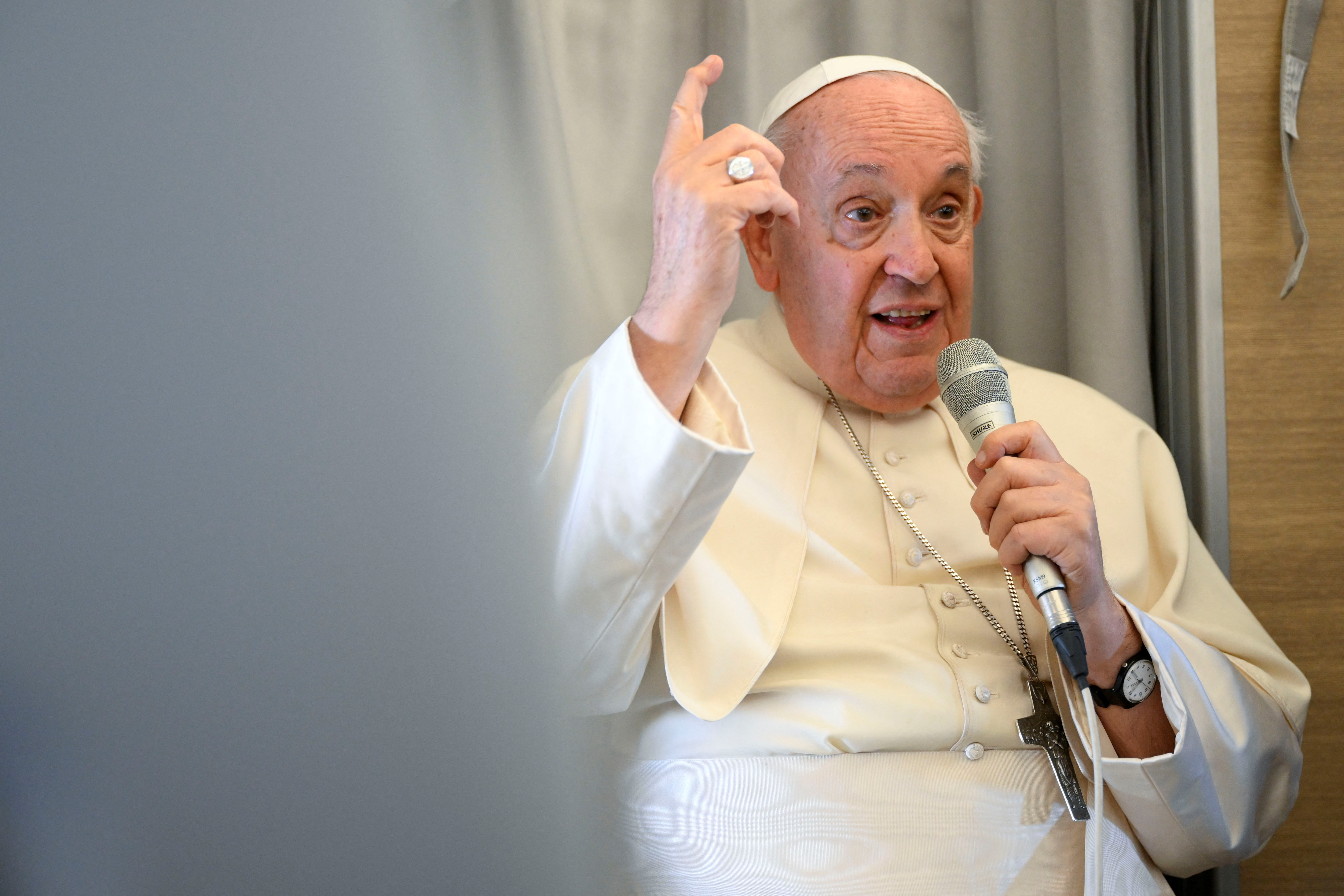 Pope Francis holds a press conference aboard the papal plane returning from Mongolia
