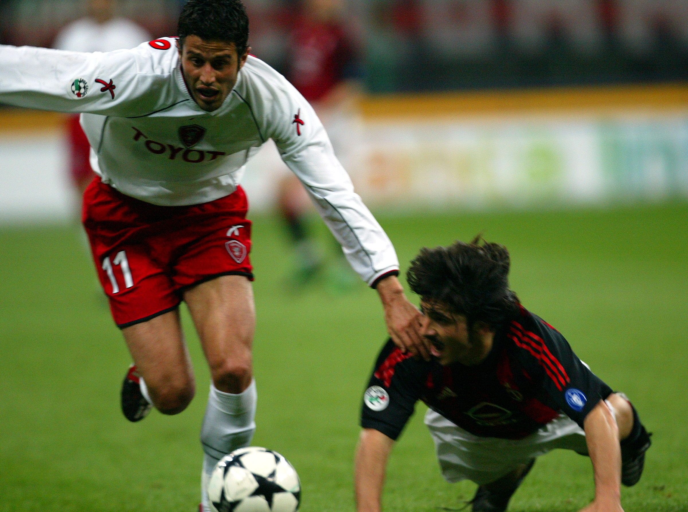 A.C. MILAN'S GATTUSO CHALLENGES GROSSO OF PERUGIA IN ITALIAN CUP SOCCERMATCH IN MILAN.