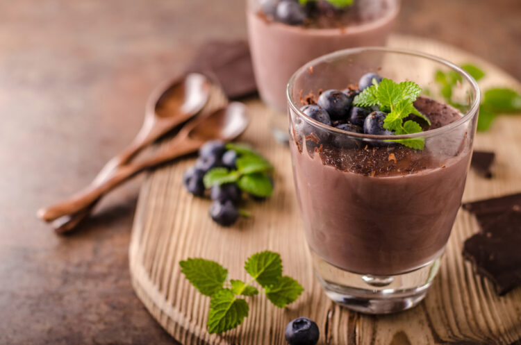 Chocolate,Pudding,With,Berries,And,Herbs,,Vintage,Rustic,Food,Styled