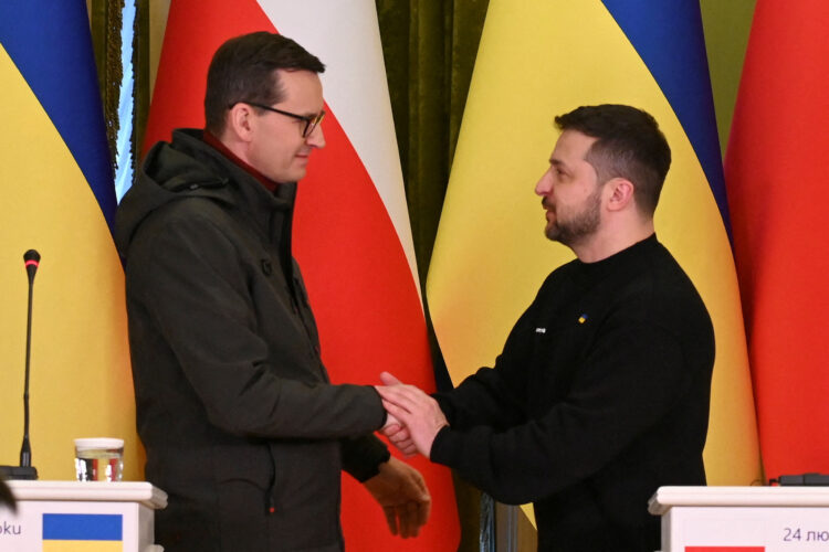 FILE PHOTO: Ukraine's President Zelenskiy and Polish PM Morawiecki shake hands during a news briefing in Kyiv