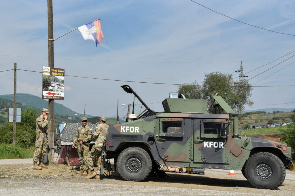 FILE PHOTO: Members of the KFOR peacekeeping force patrol the area near the border crossing between Kosovo and Serbia  in Jarinje