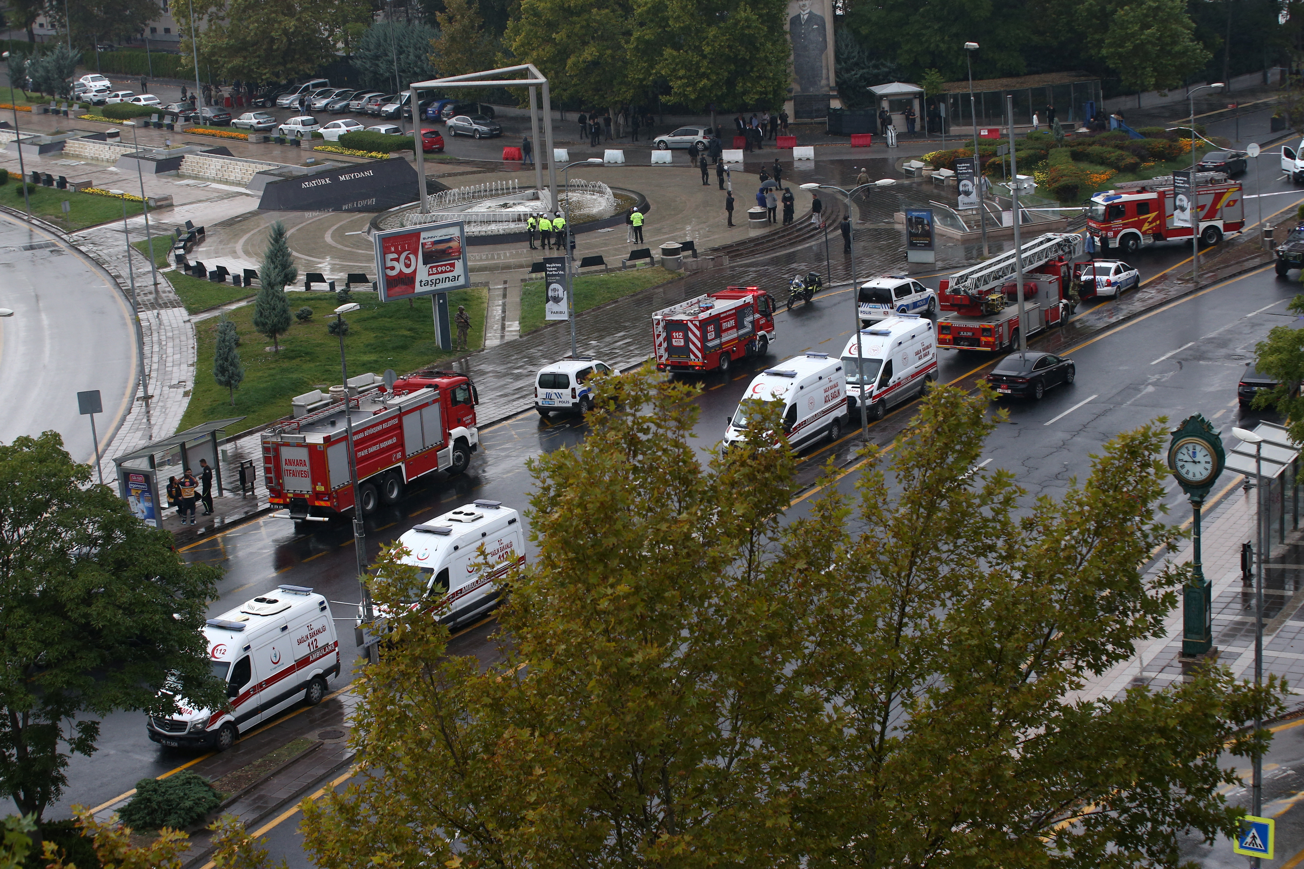 Ambulances and fire trucks are seen outside the Interior Ministry following a bomb attack in Ankara