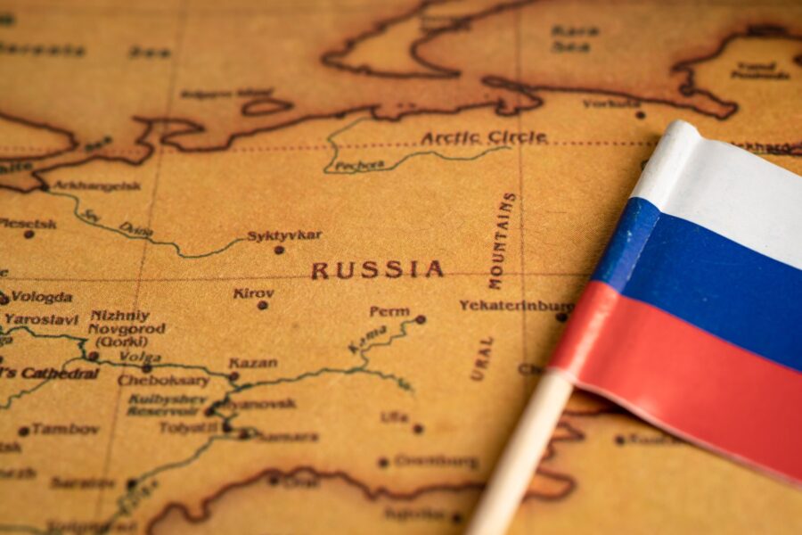 Bangkok, Thailand - February 1, 2022 Russia flag on world map background.