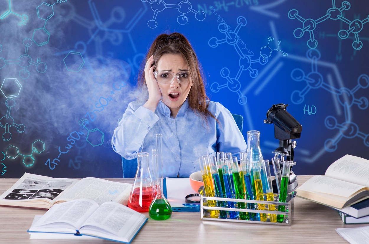 Scared woman chemist after unsuccessful chemical experiment
