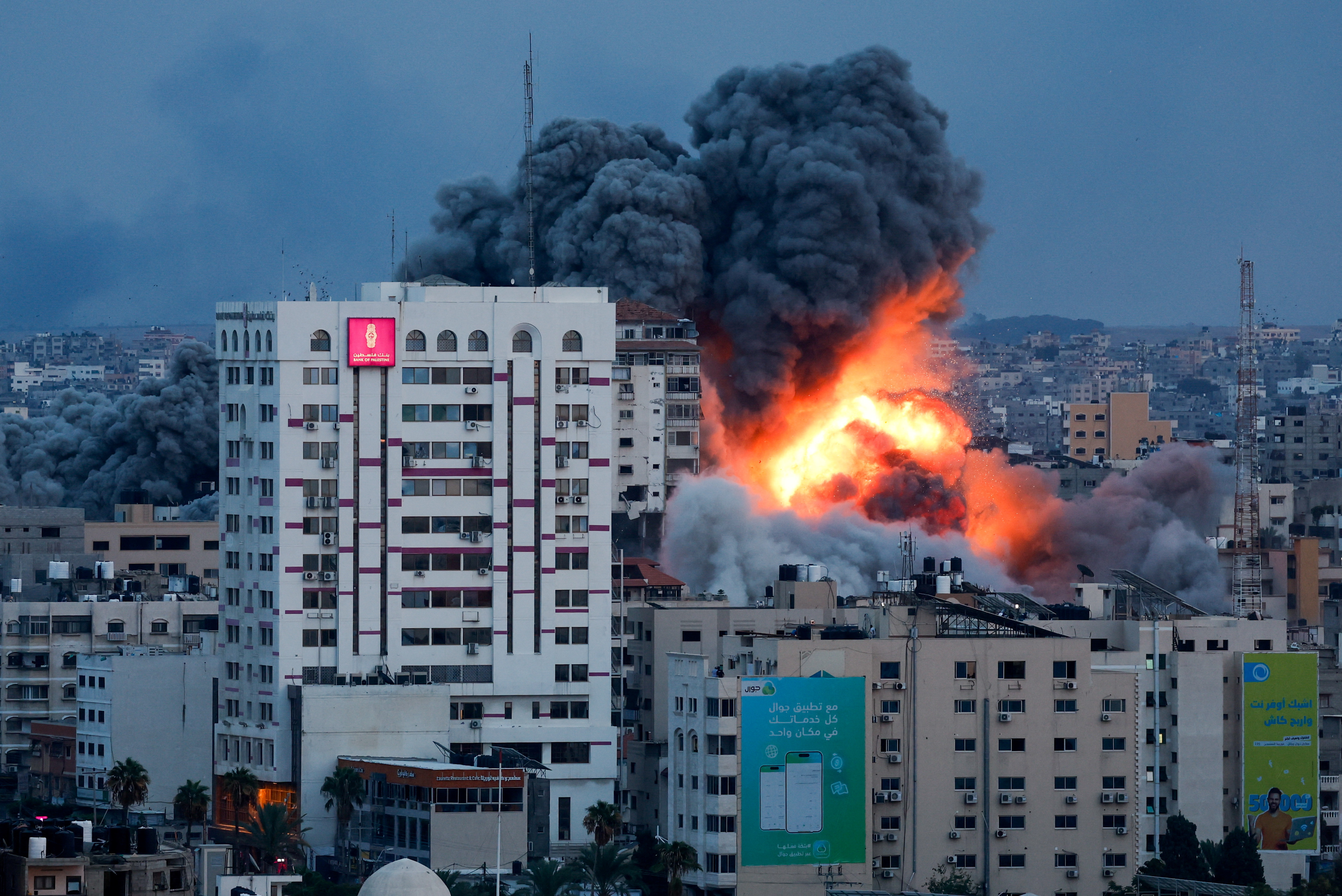 Smoke and flames billow after Israeli forces struck a high-rise tower in Gaza City