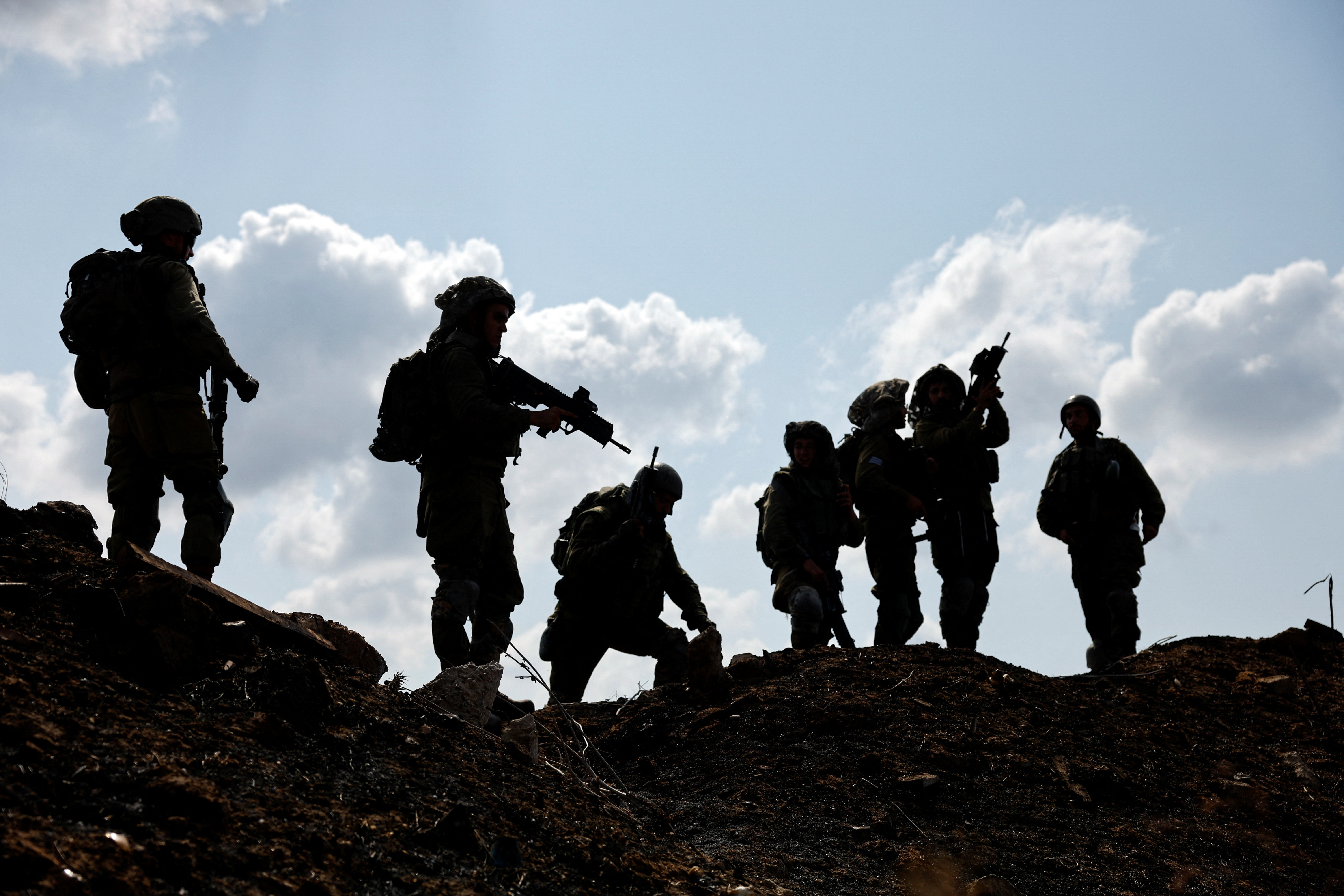 Israeli soldiers gather after the alert of an apparent security incident, in Ashkelon, southern Israel