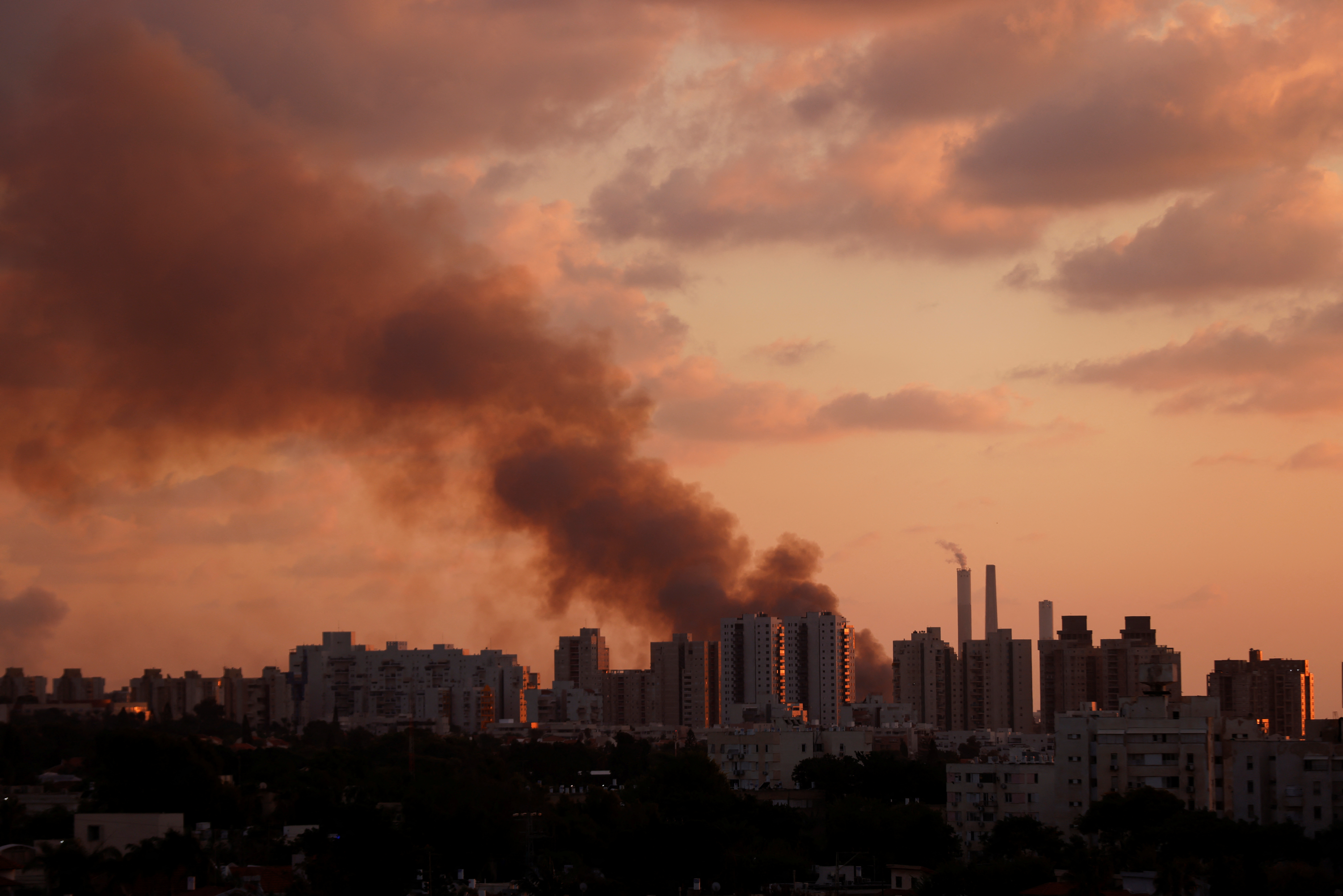 Smoke is seen behind Ashkelon near Israel's border with the Gaza Strip, in southern Israel