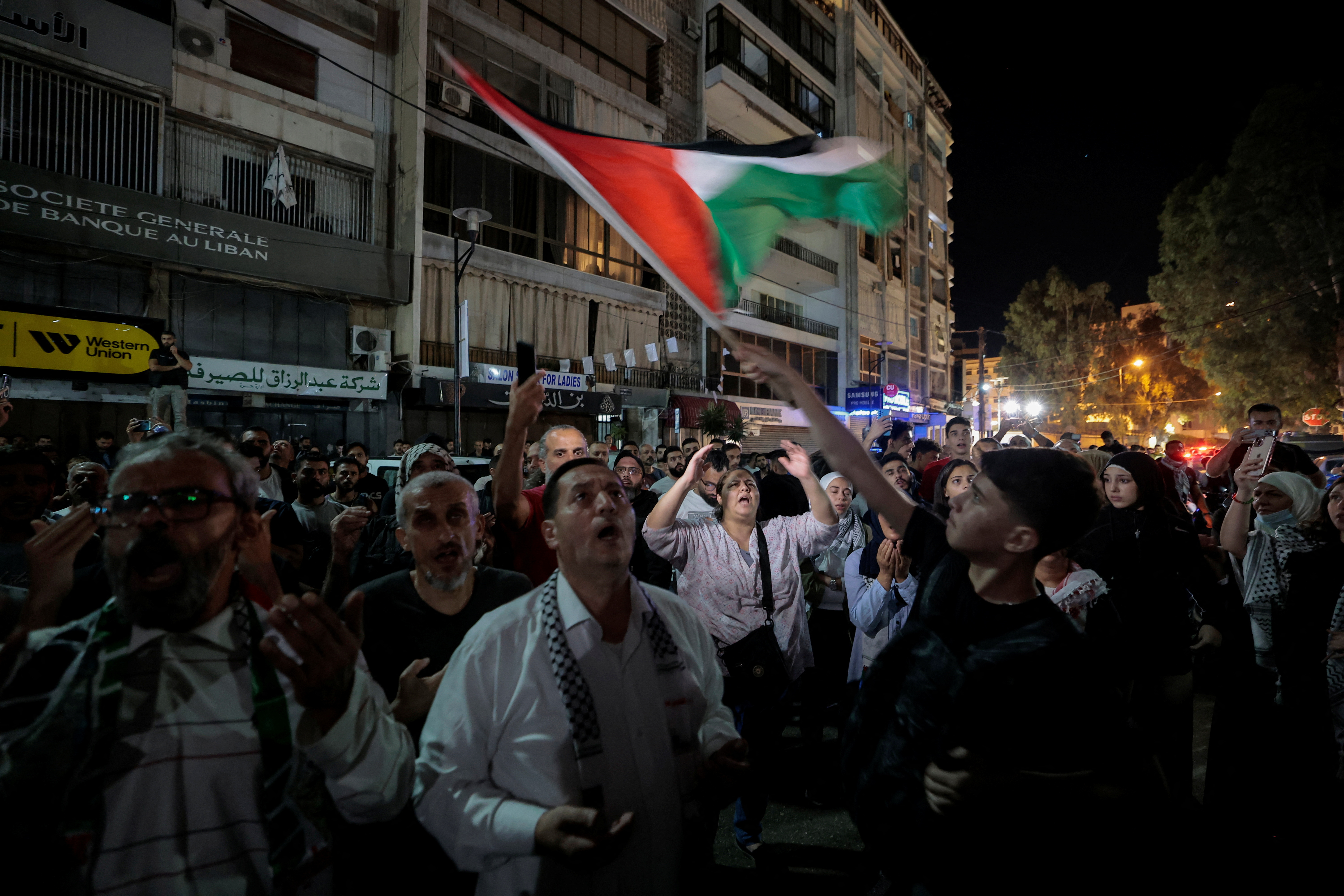People pray as they protest after hundreds of Palestinians were killed in a blast at Al-Ahli hospital in Gaza that Israeli and Palestinian officials blamed on each other, in Beirut