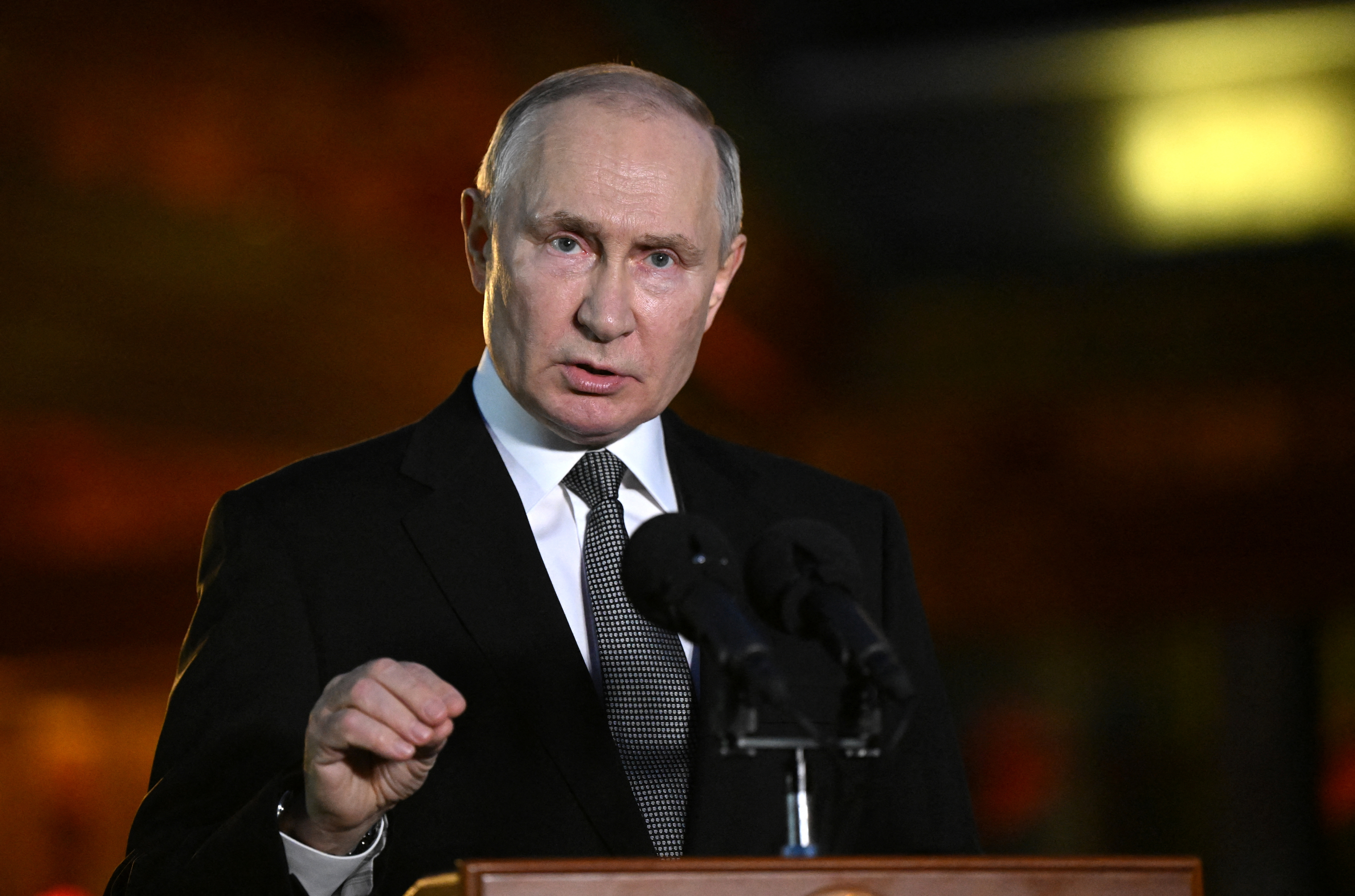 Russian President Putin attends a press conference in Beijing