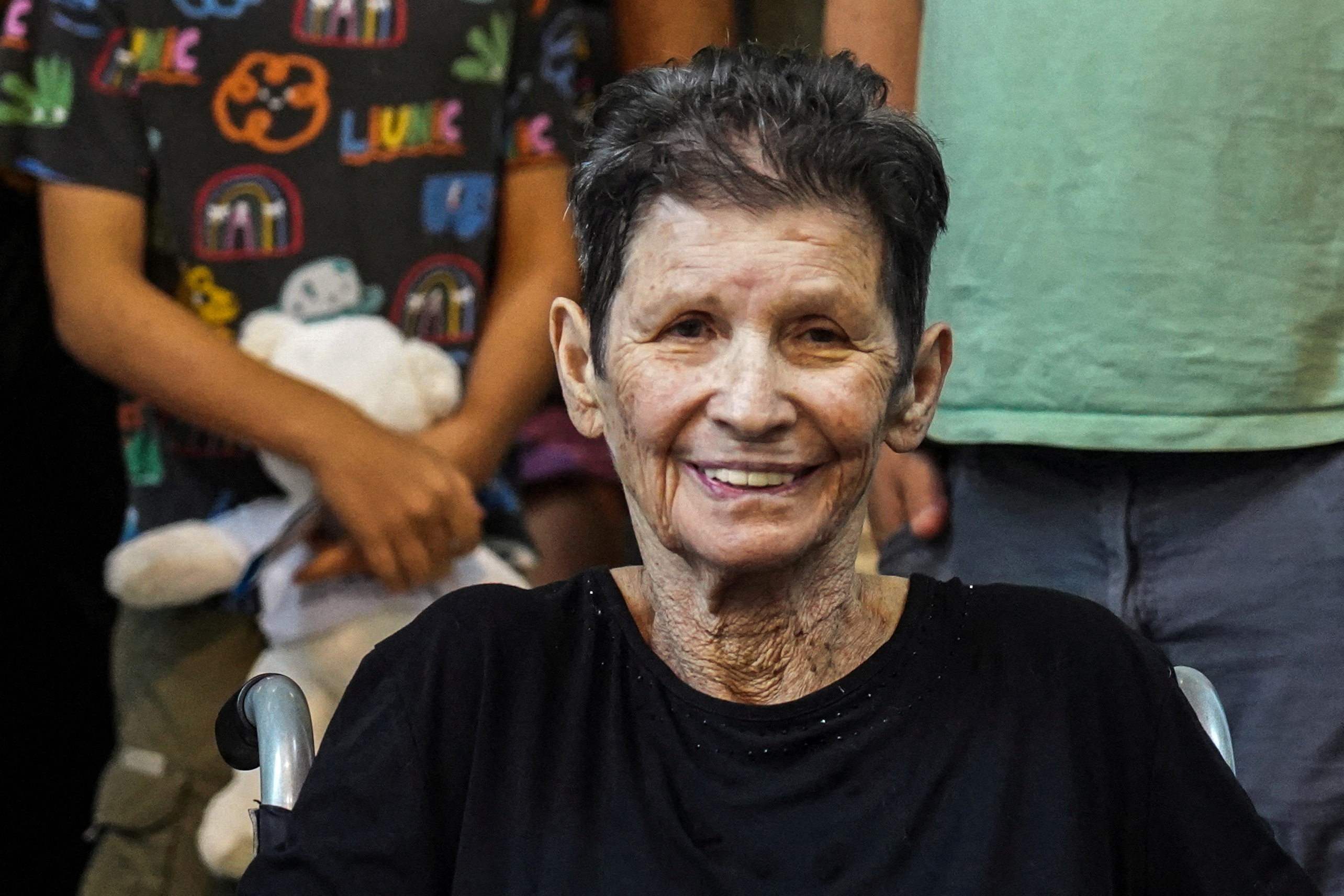 Lifshitz, 85, an Israeli grandmother who was held hostage in Gaza smiles after being released by Hamas militants, at Ichilov Hospital in Tel Aviv