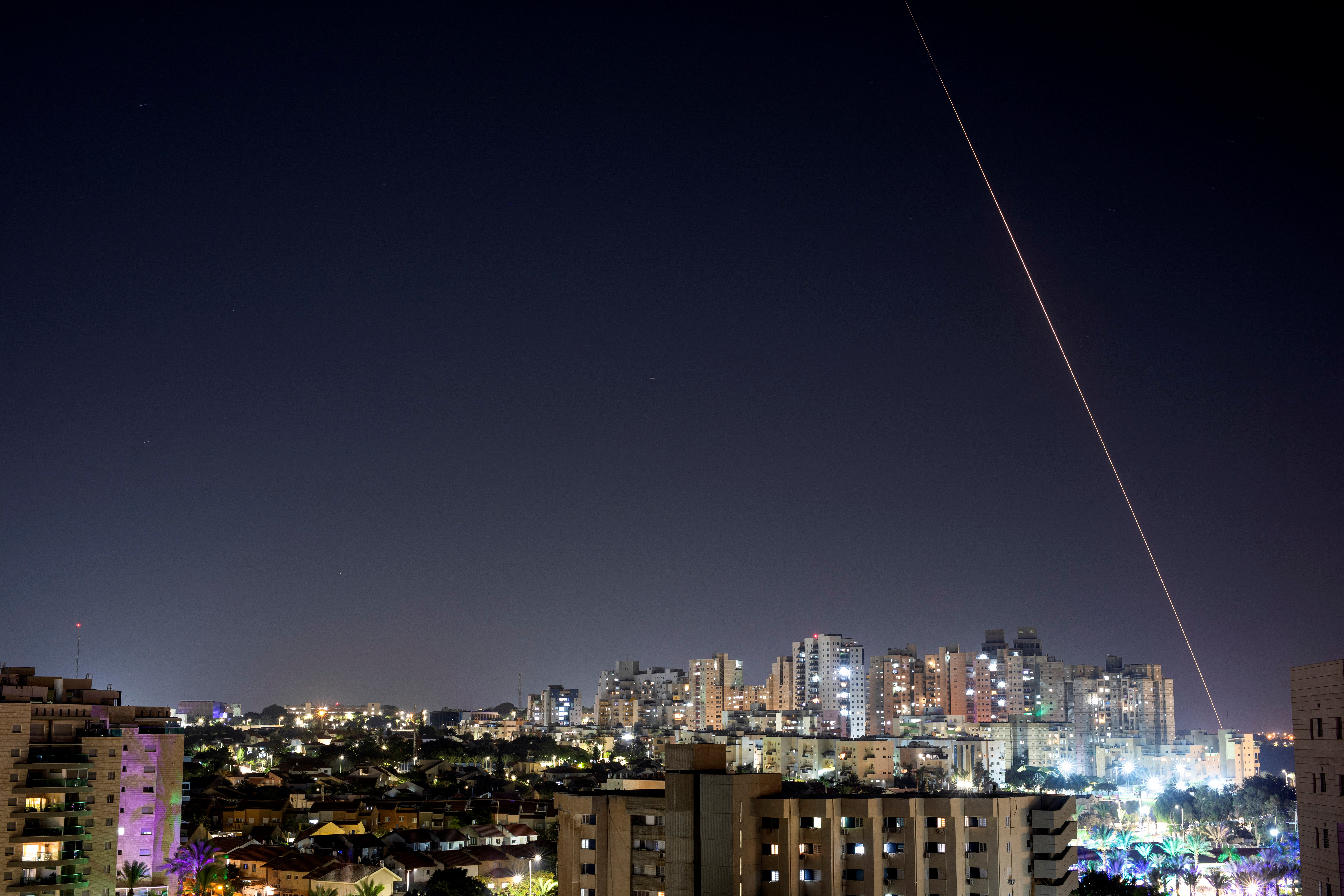 A view shows a rocket being launched from the Gaza Strip towards central Israel, as seen from Ashkelon