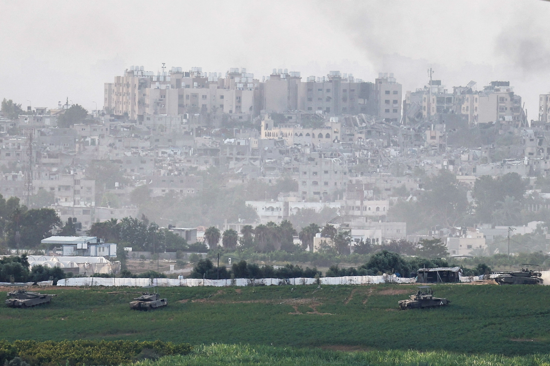 Israeli tanks manoeuvre inside the Gaza Strip, as seen from Israel
