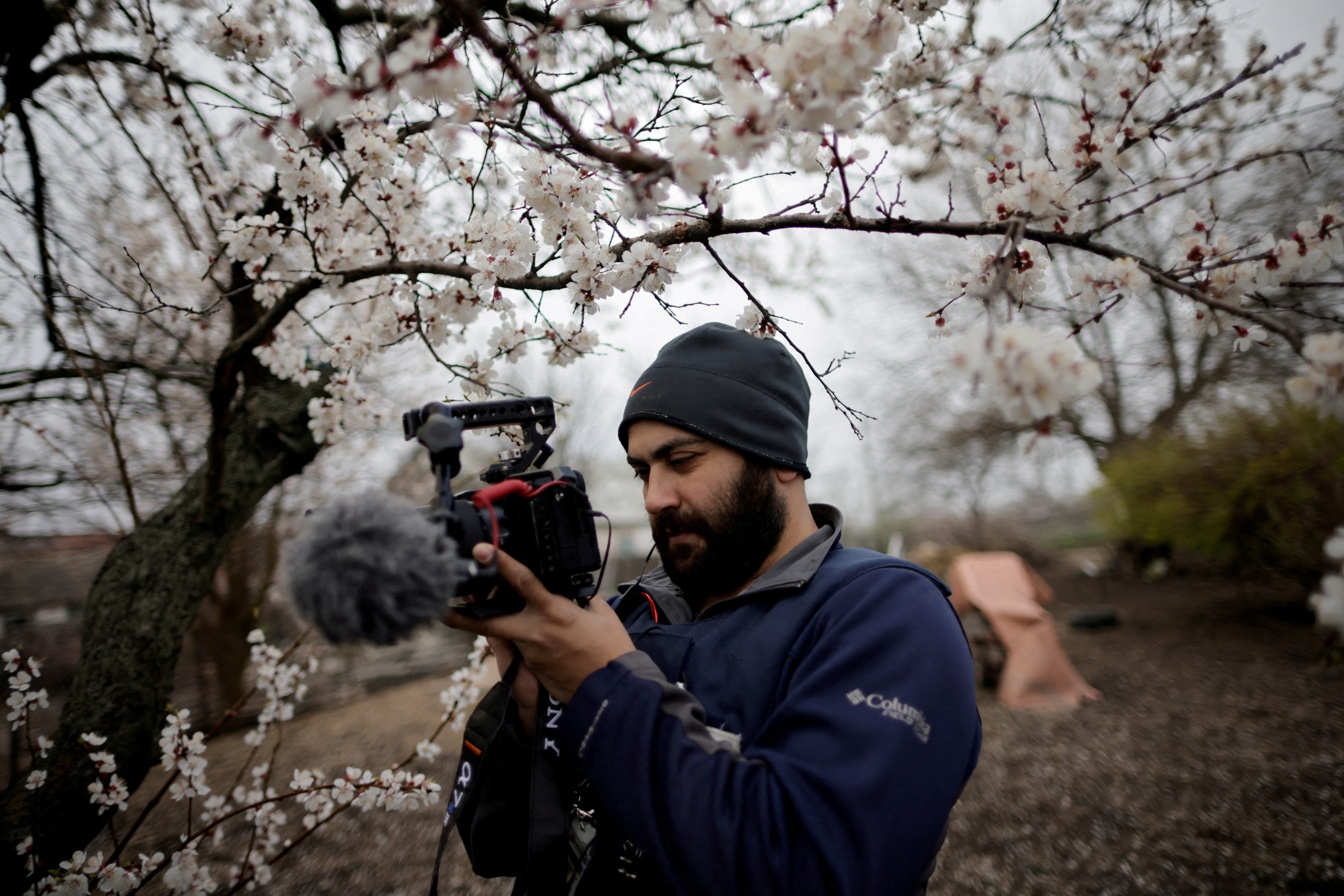 FILE PHOTO: Reuters' journalist Issam Abdallah films Ukrainian woman Zhanna Lishchynska (not pictured) during an interview with Reuters, in Zaporizhzhya