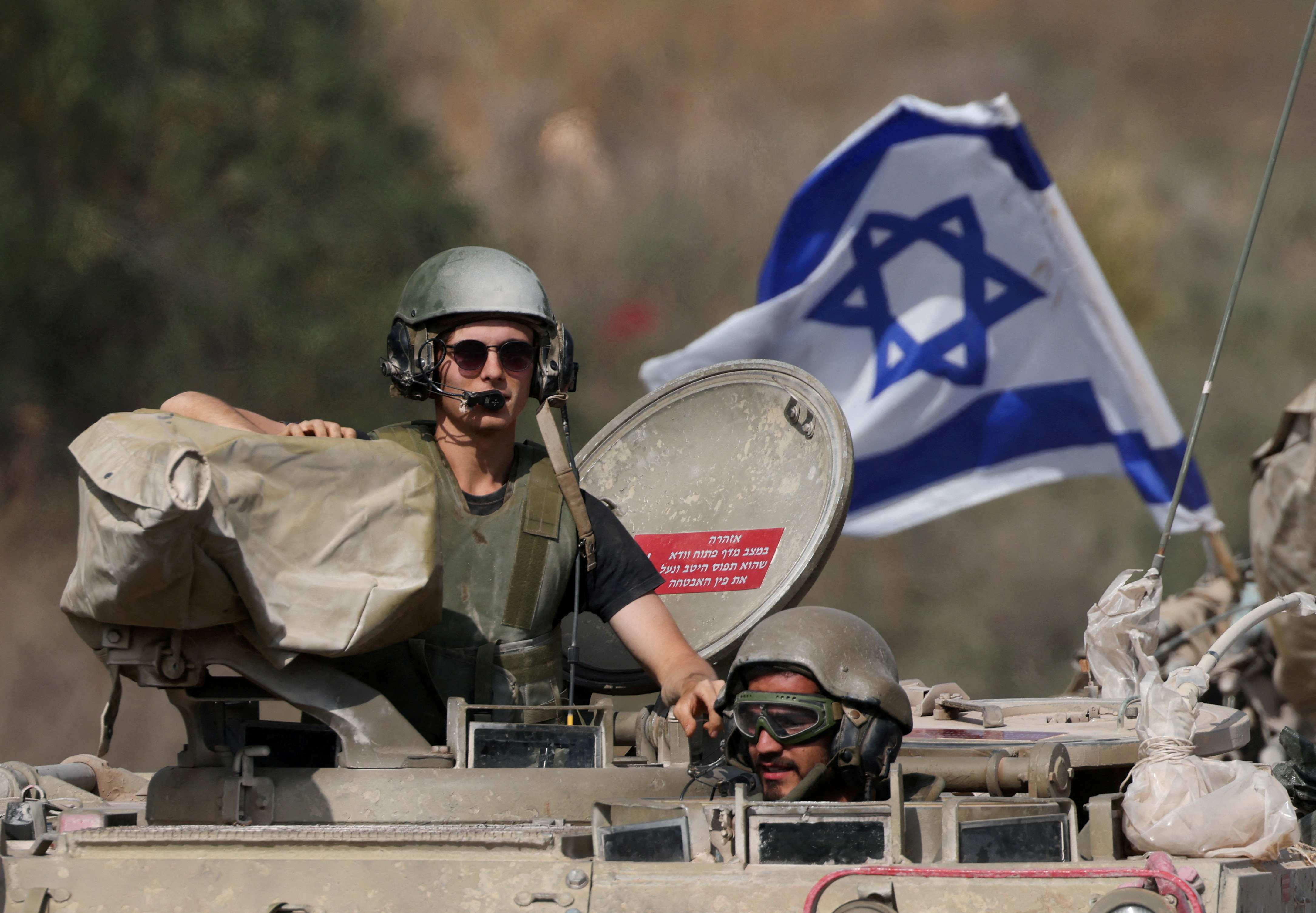 Israeli soldiers drive medical military vehicles near Israel's border with Lebanon, in northern Israel