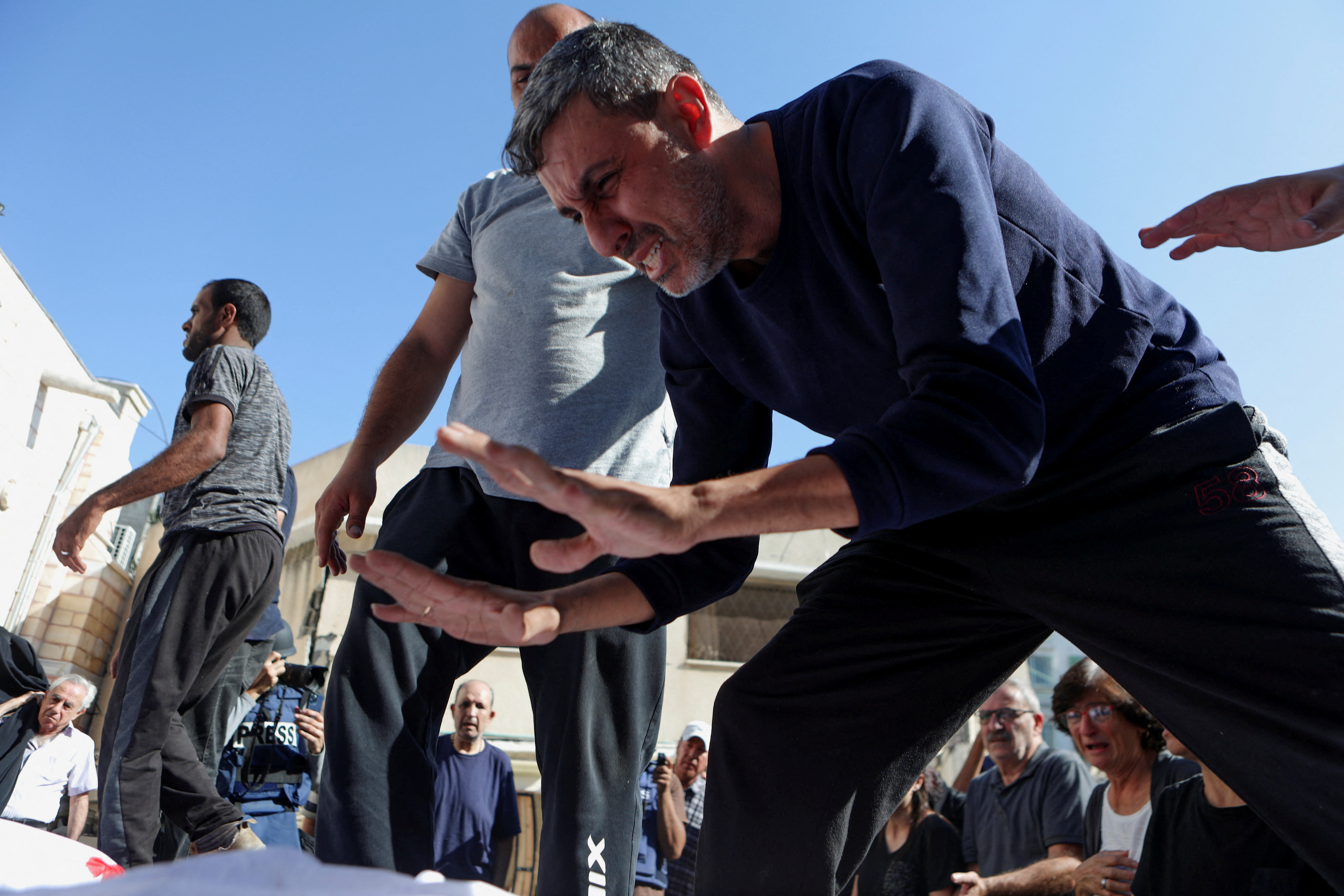 Worshippers attend a funeral at Greek Orthodox Saint Porphyrius Church, in Gaza City