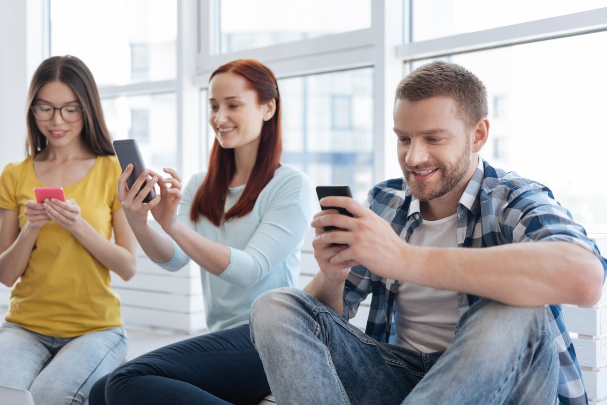 Nice young people using their smartphones