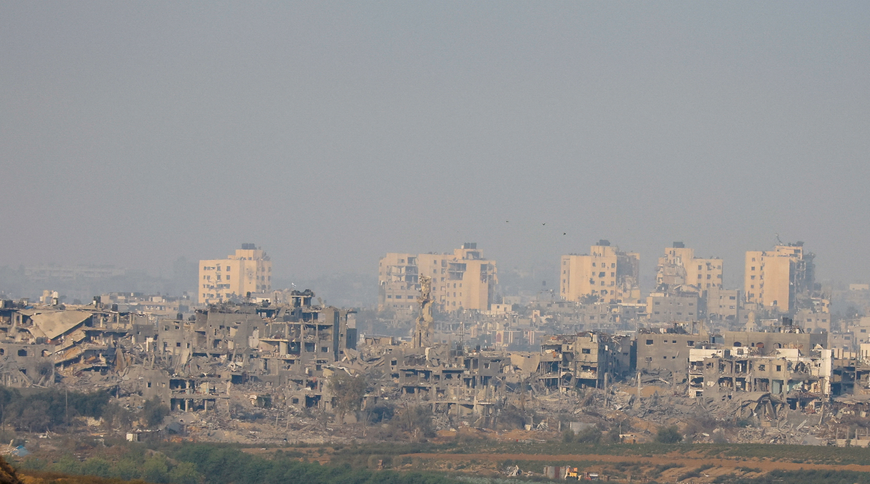 A view of damaged buildings in Gaza following artillery strikes, as seen from southern Israel