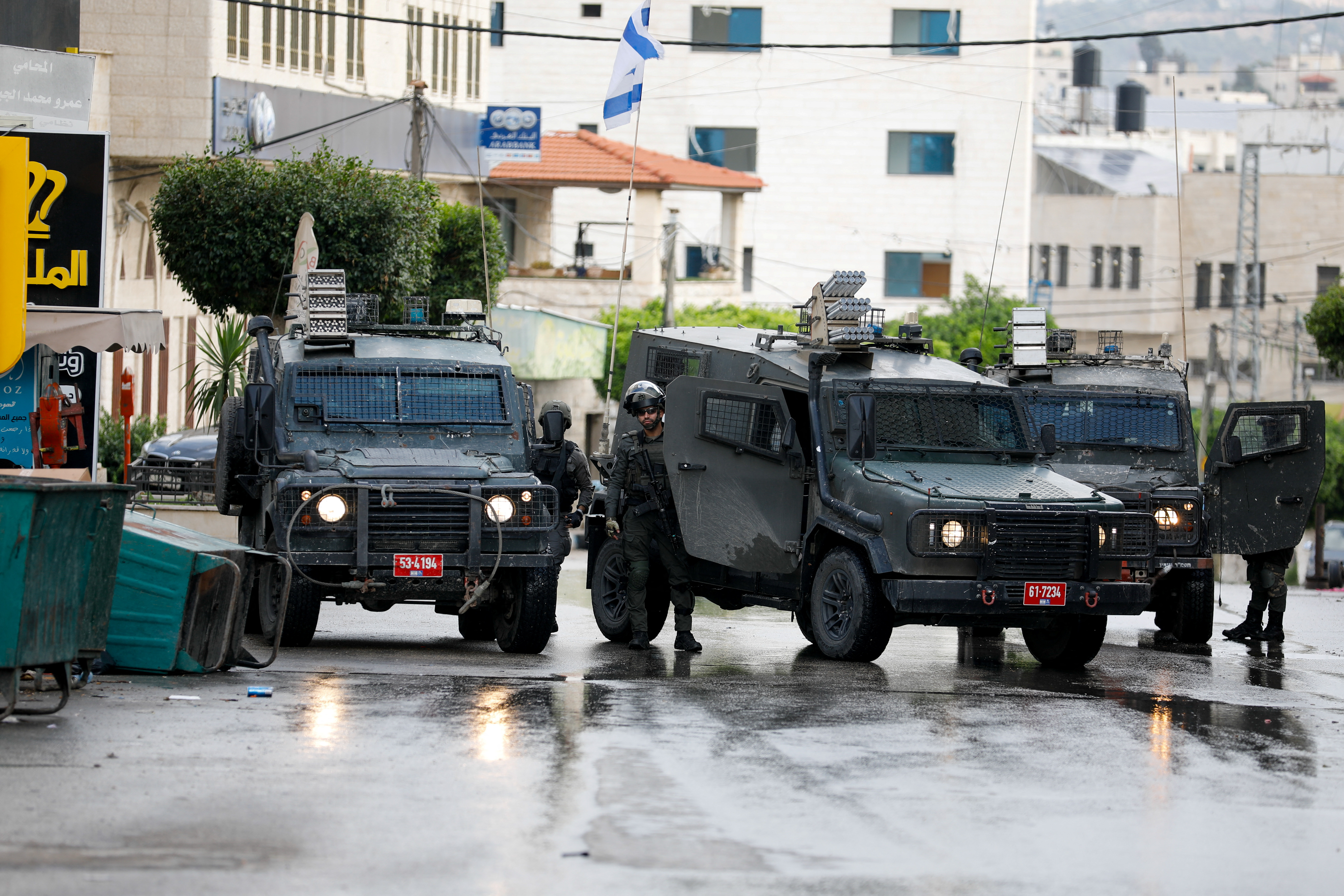 Israeli army vehicles operate during an Israeli raid, in Tulkarm