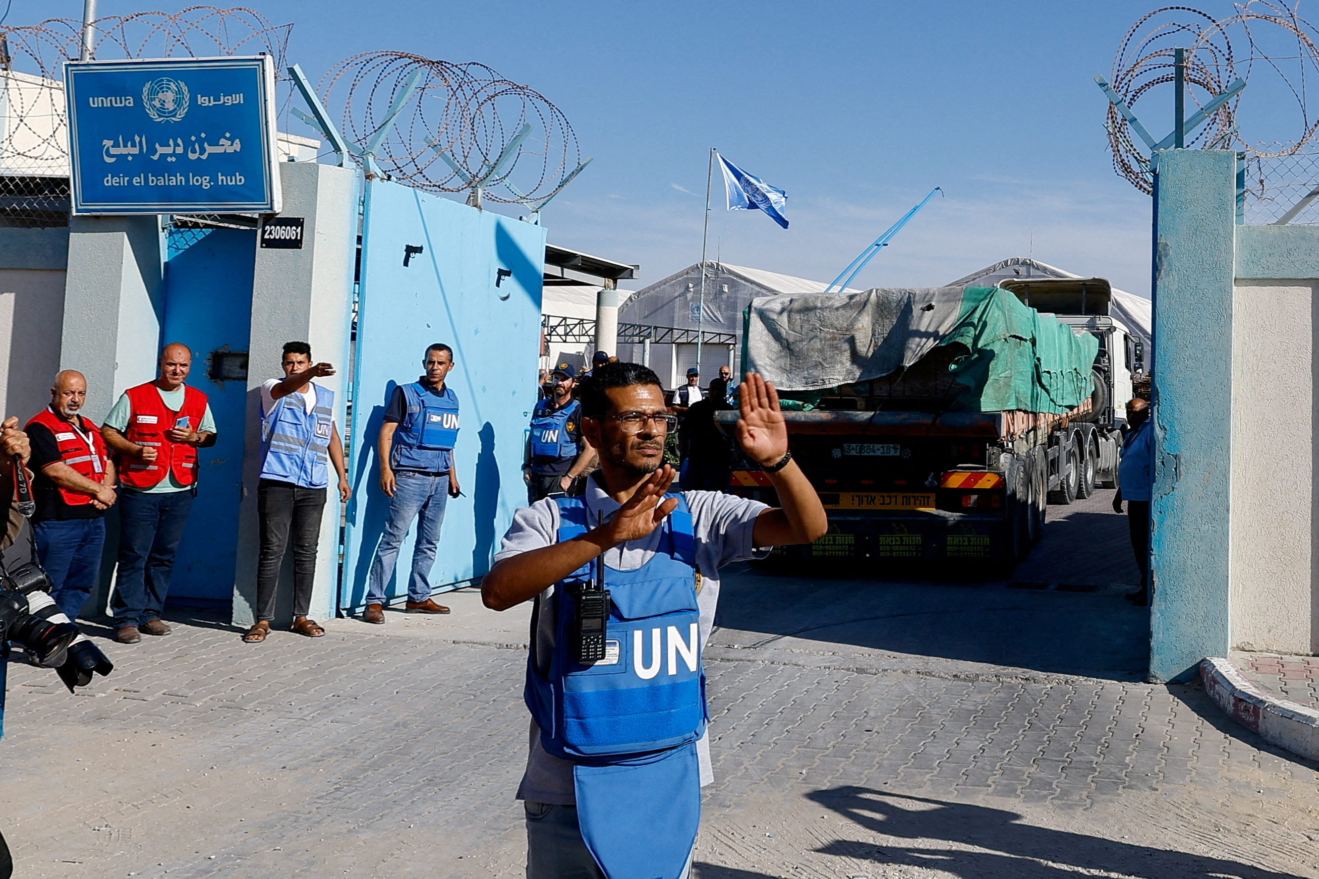 FILE PHOTO: Aid trucks arrive at a UN storage facility in the central Gaza Strip