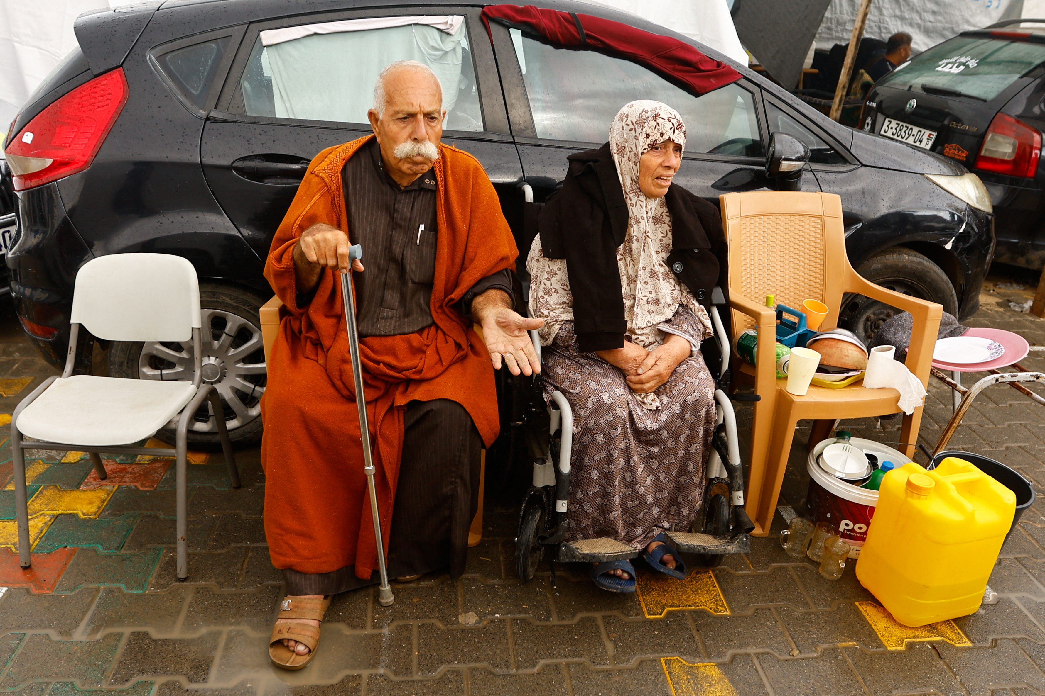 Displaced Palestinians shelter in a tent camp, in Khan Younis
