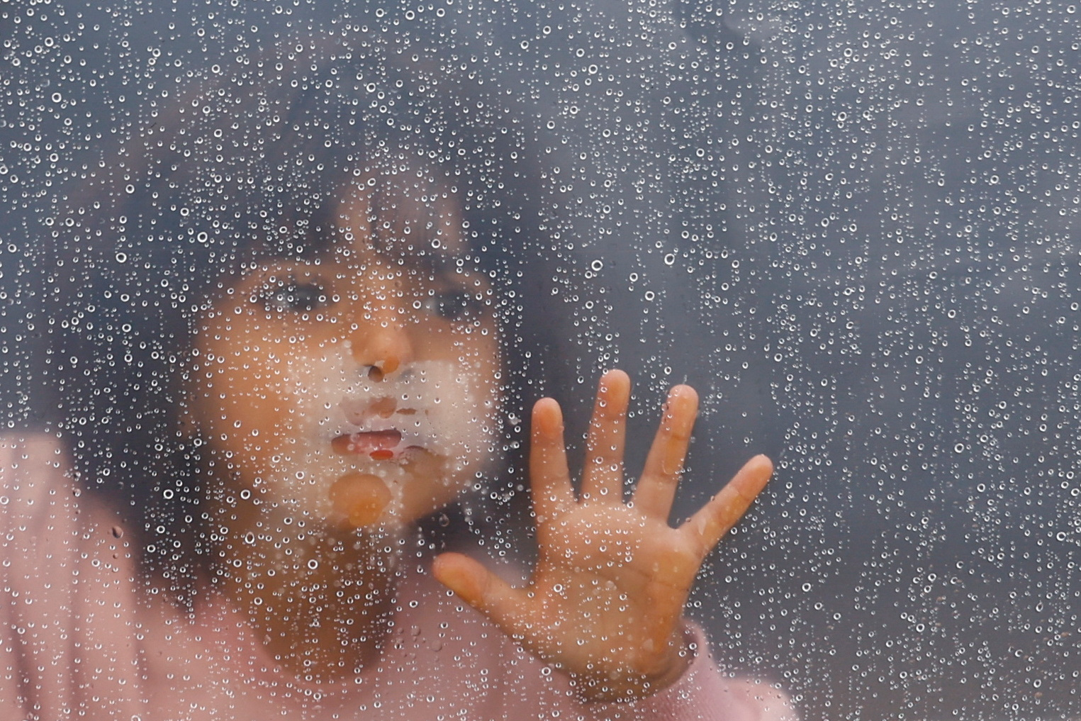 Displaced Palestinians shelter in a tent camp, in Khan Younis