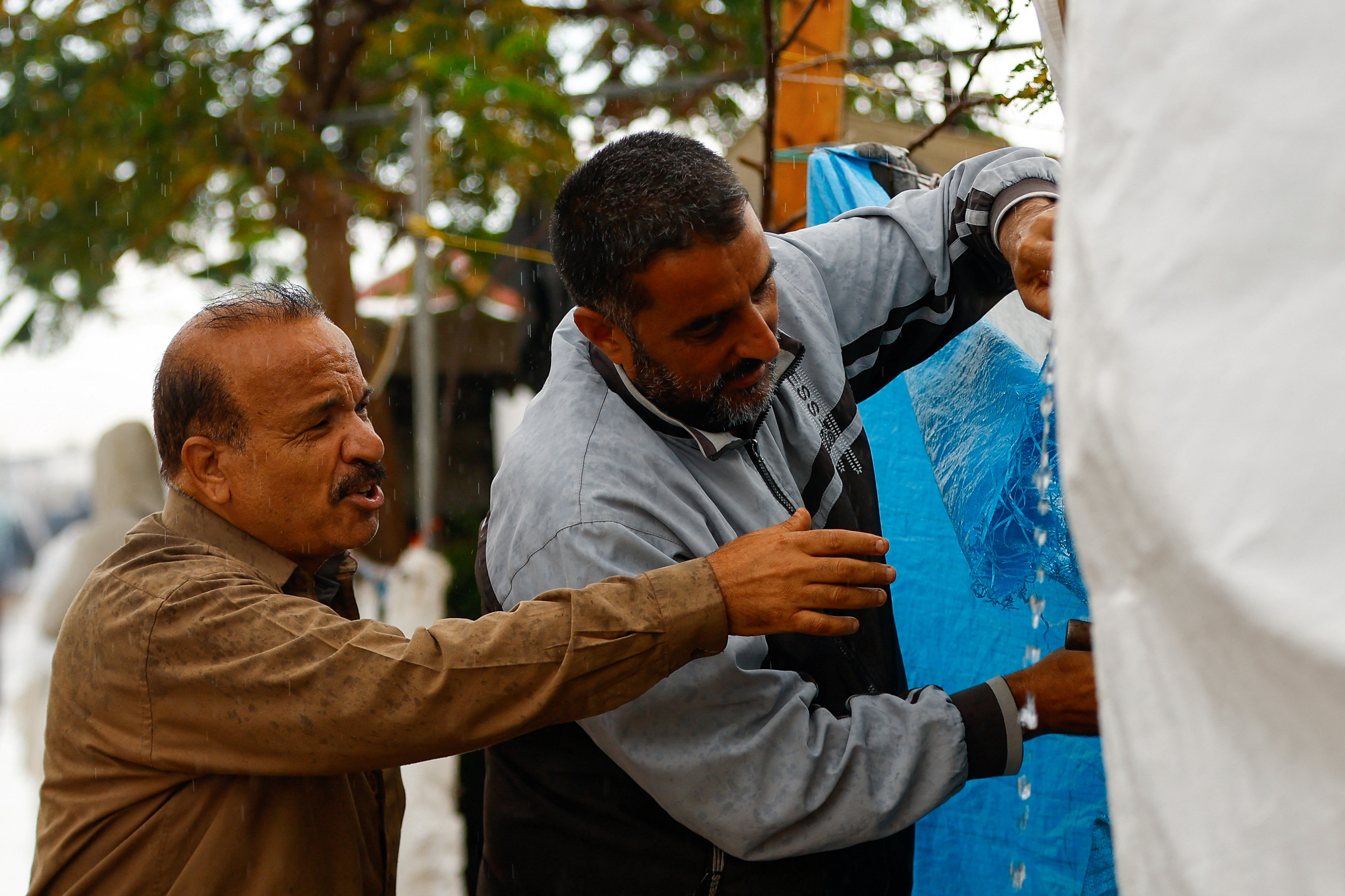 Displaced Palestinians shelter in a tent camp, in Khan Younis