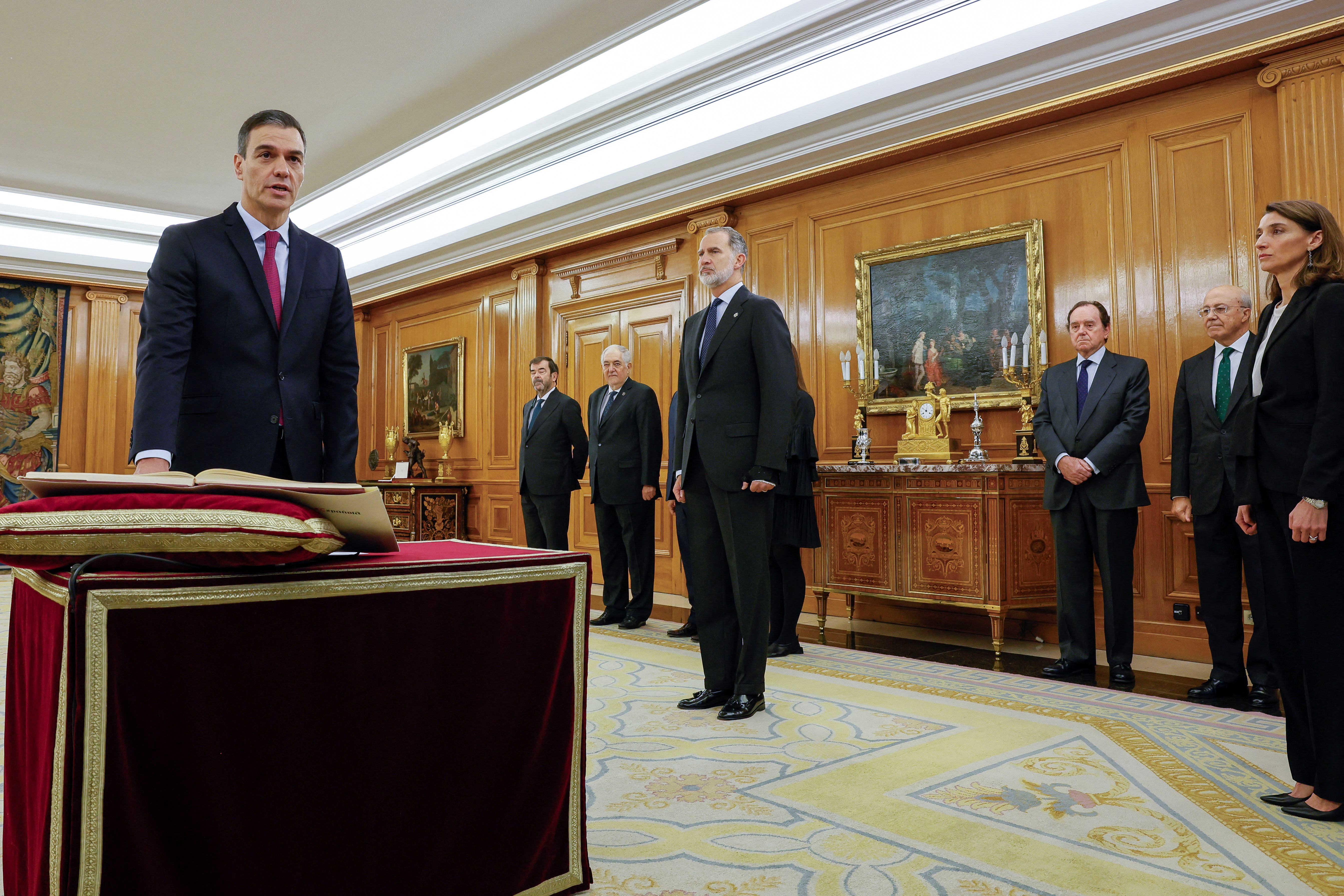 Spain's PM Sanchez takes the oath of office during a ceremony at Zarzuela Palace in Madrid