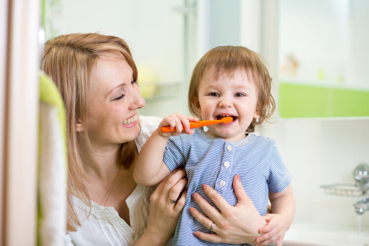 Mother,Teaching,Son,Child,Teeth,Brushing,In,Bathroom