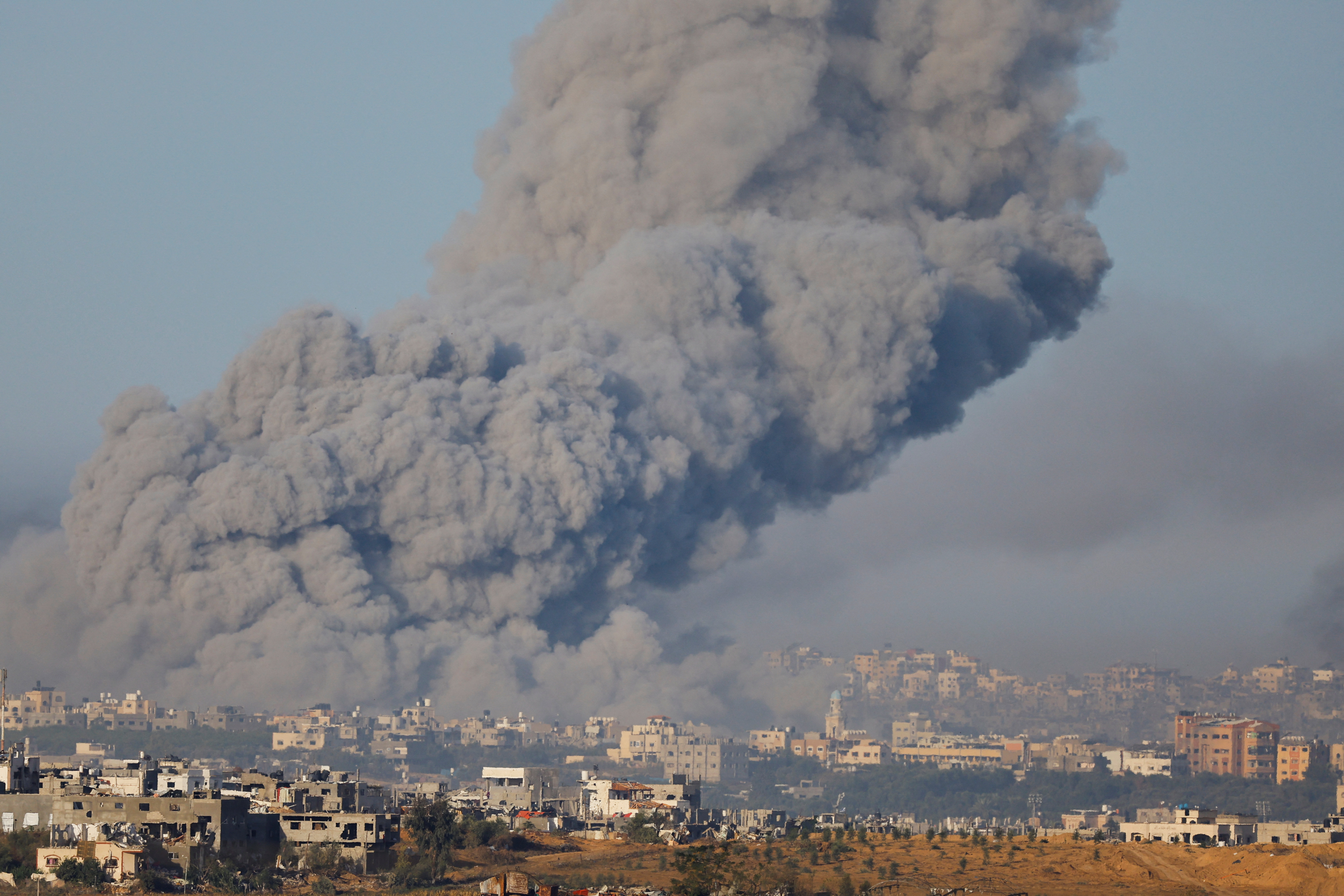 Smoke rises after Israeli air strikes in Gaza, as seen from southern Israel
