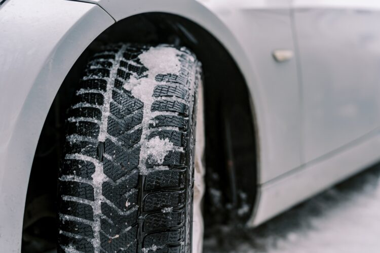 Adhering,Snow,On,The,Front,Tread,Of,A,Car,Wheel