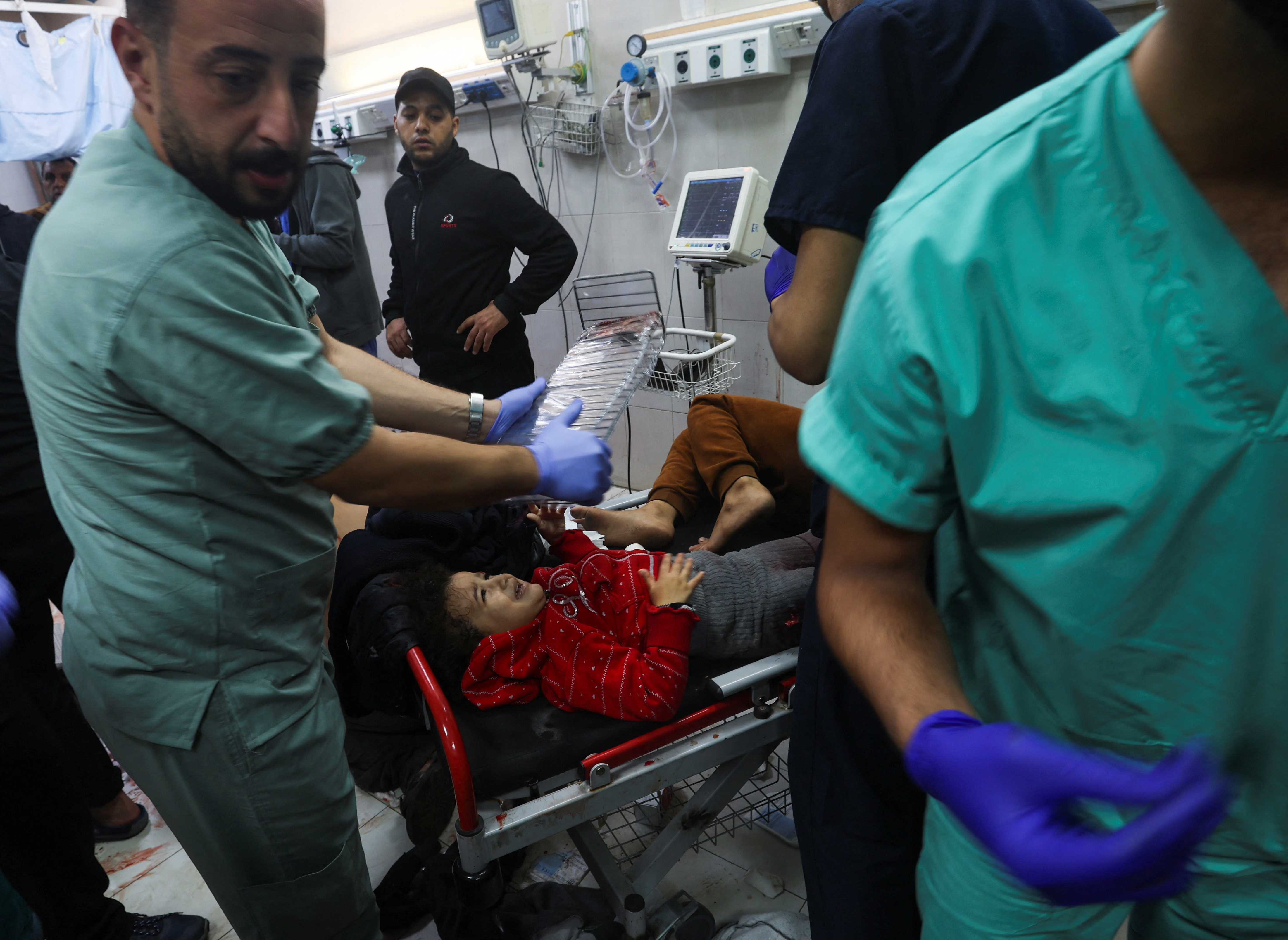 Wounded Palestinians are rushed into Nasser hospital, in Khan Younnis