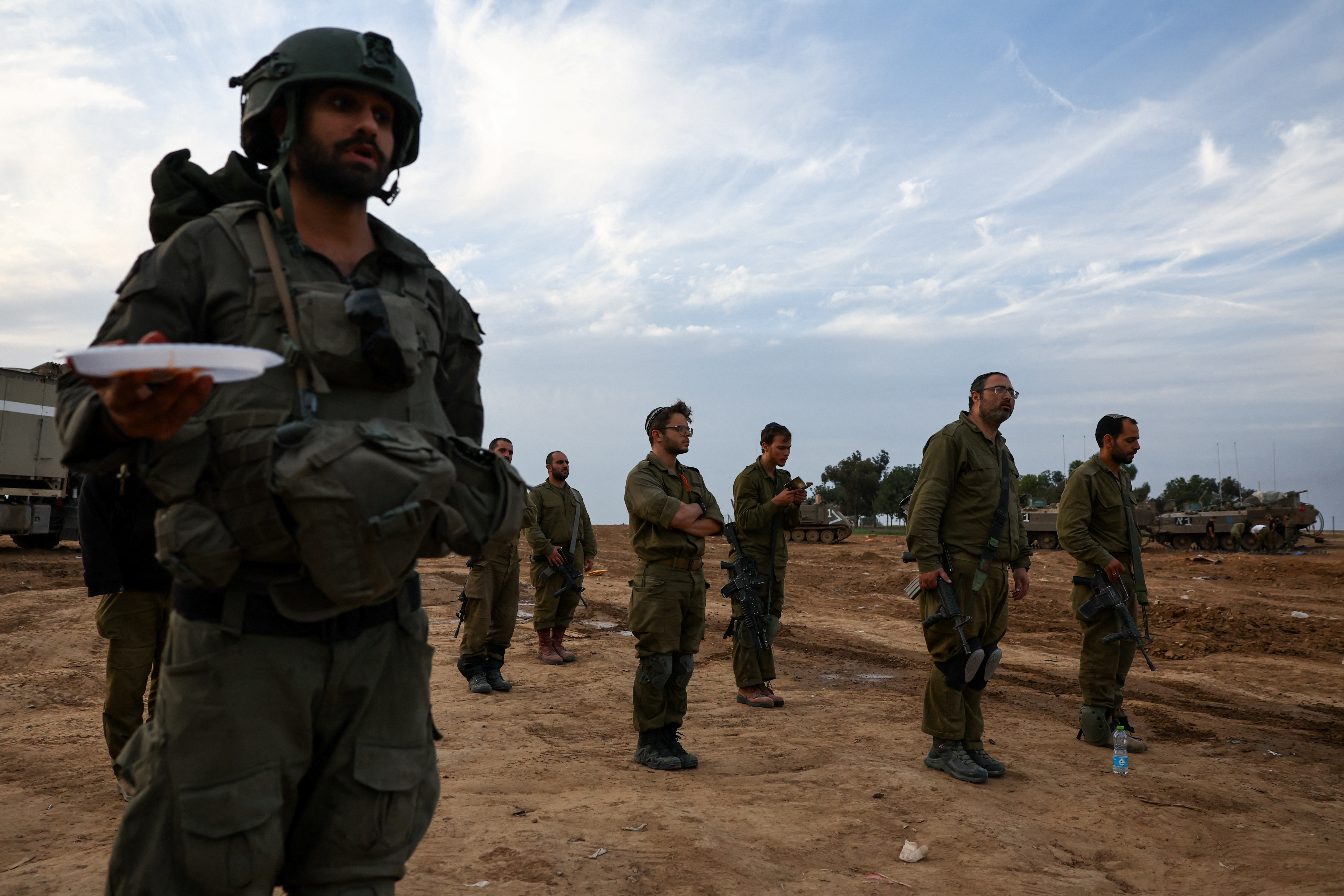 Israeli soldiers pray near border with Gaza Strip, in Beeri