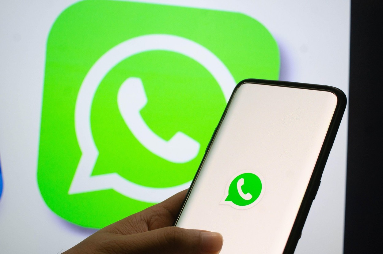 Jaipur, India, Circa 2020 - A mobile logged into the whatsapp mobile application infront of the white light board with whatsapp logo on it. The backgr