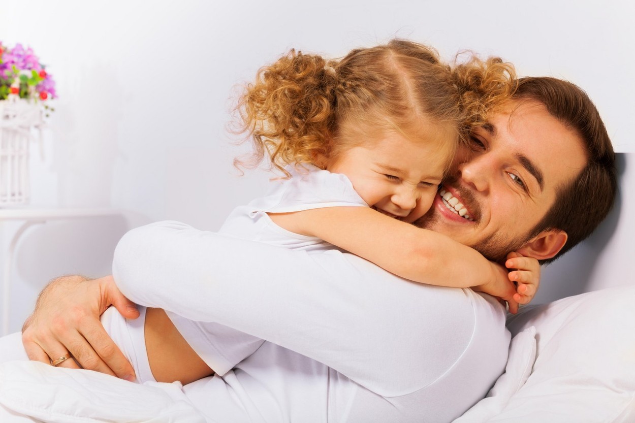 Charming portrait of happy father and  daughter