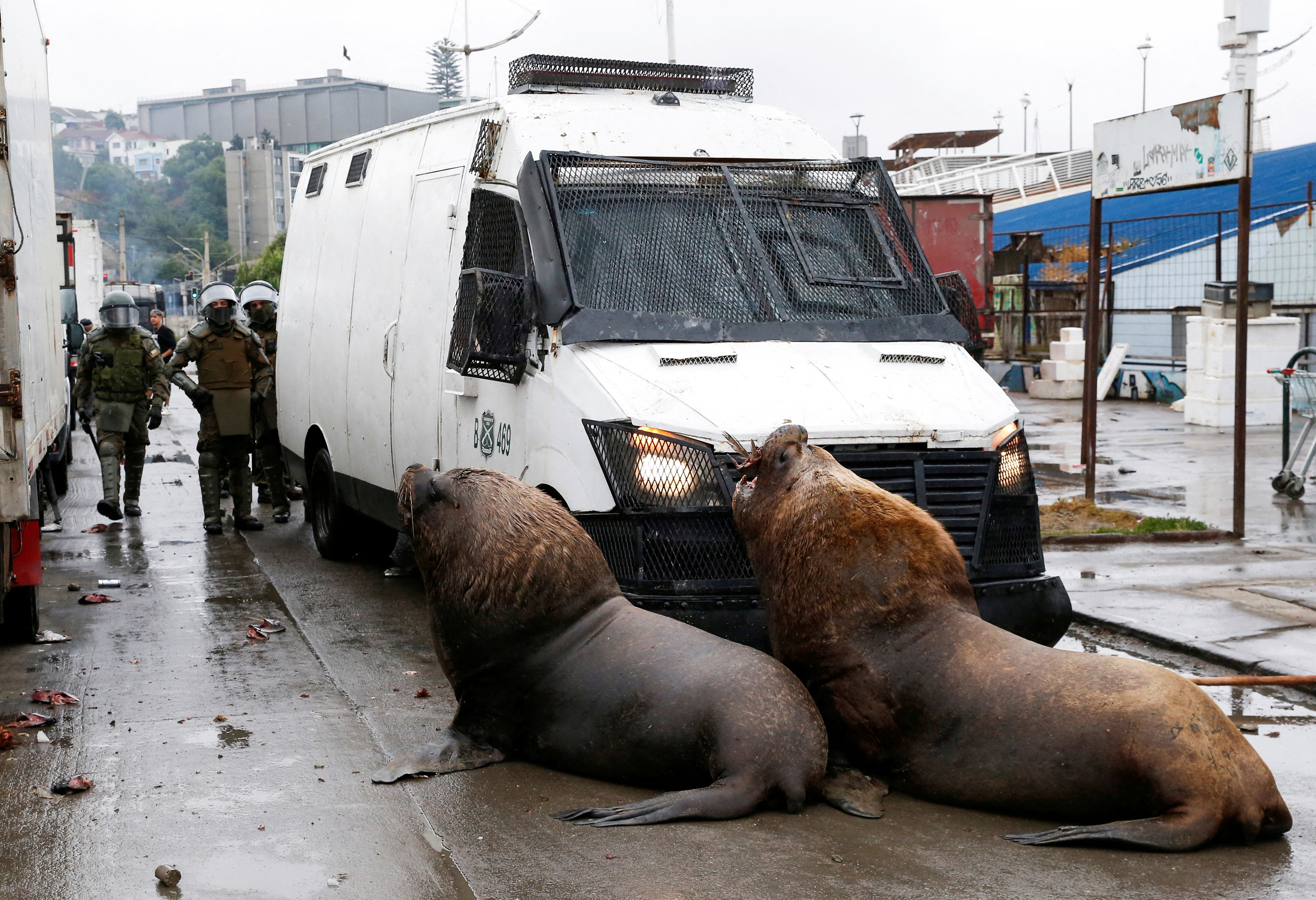 Fishermen clash with riot police during a protest against the government, in Valparaiso