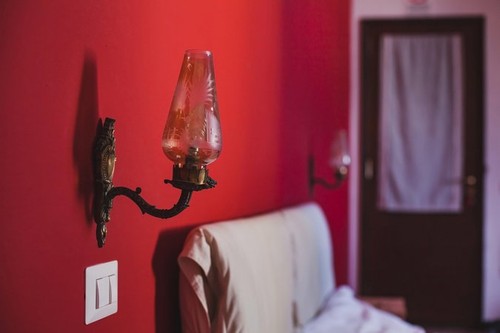 interior of abstract bedroom with red wall