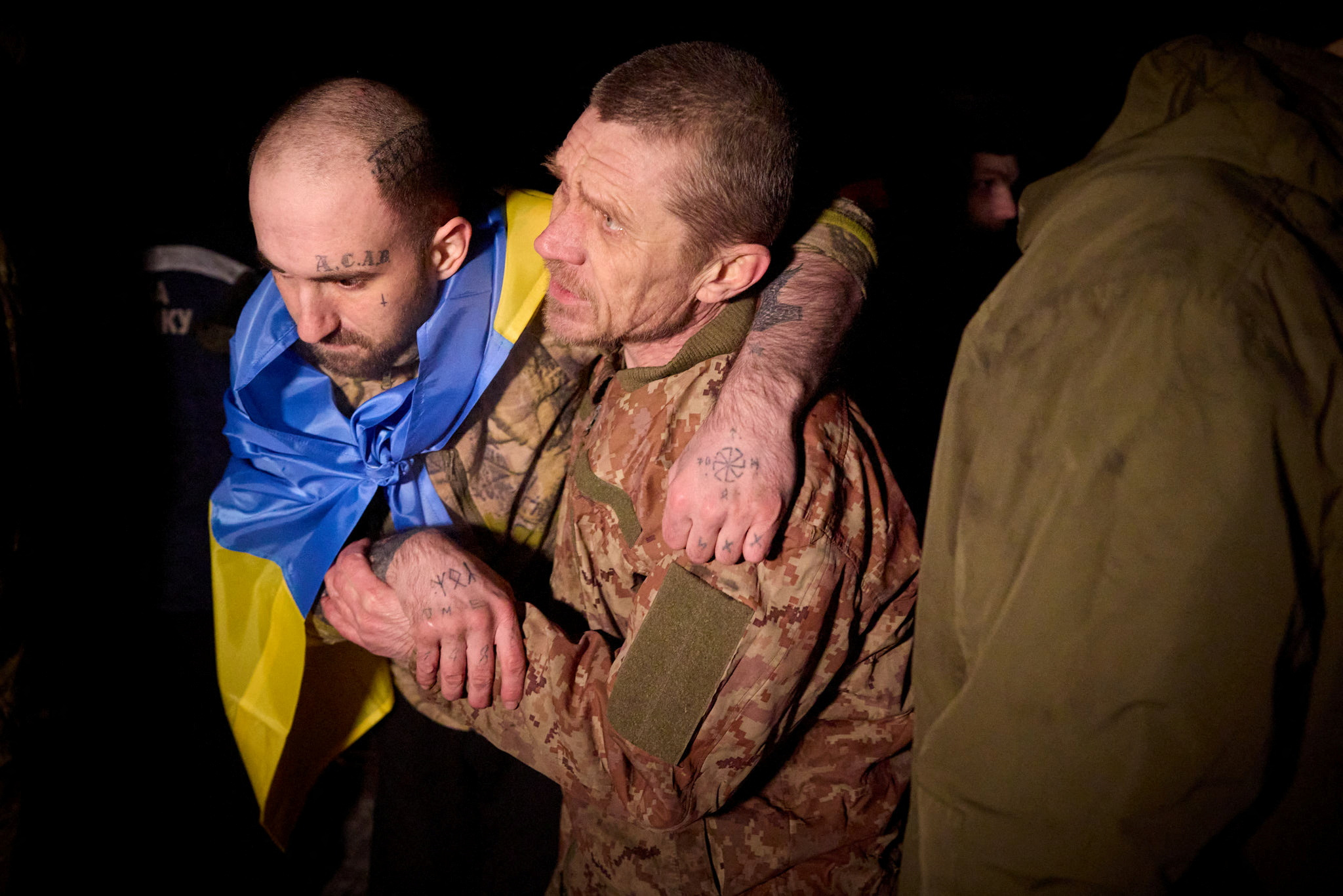 Ukrainian POWs react after a swap at an unknown location in Ukraine