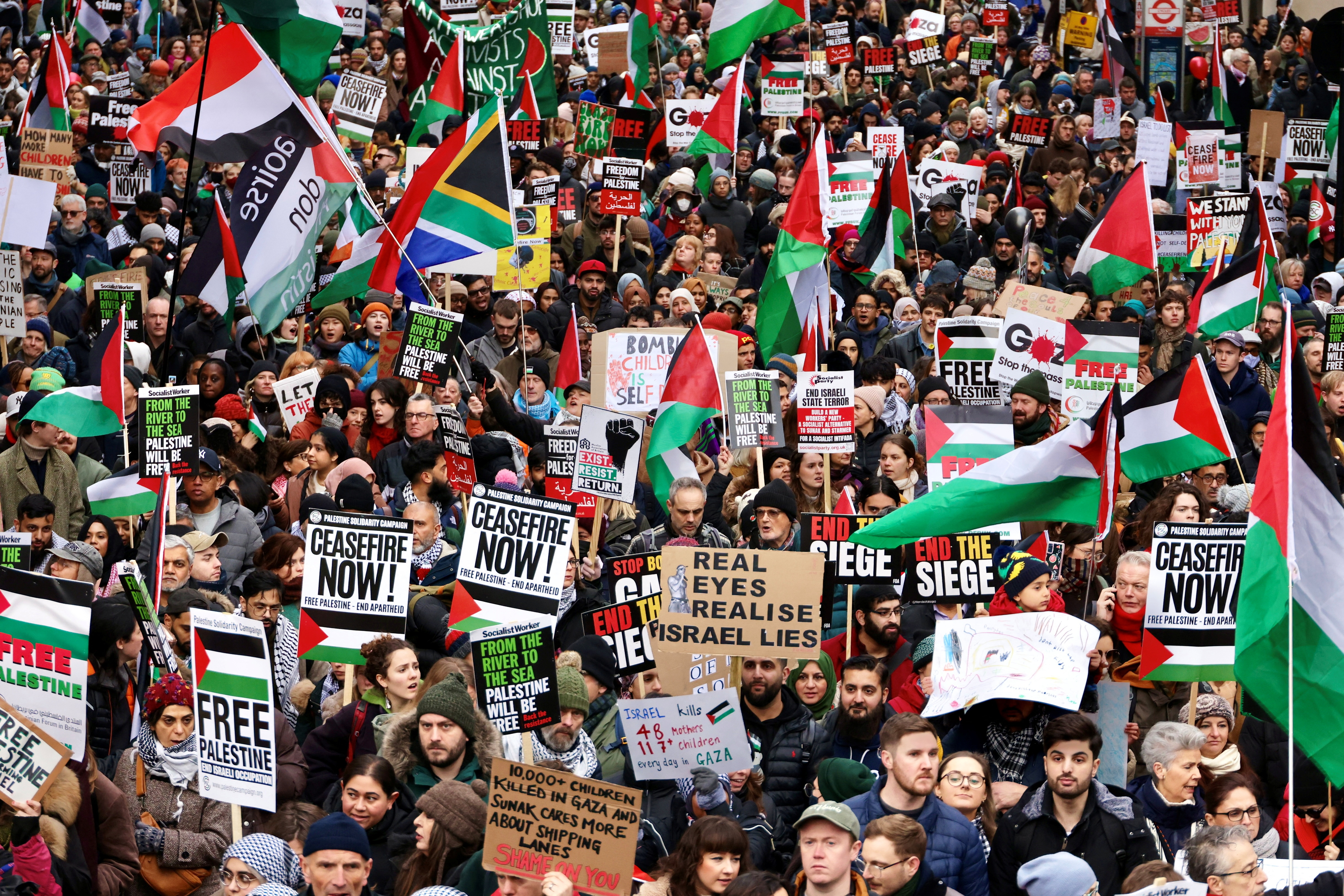 People take part in a protest to mark 100 days since the start of the ongoing Israel-Hamas conflict, in London