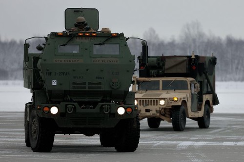 An M142 High-Mobility Artillery Rocket System (HIMARS) and a platoon operations center from 3rd Battalion, 27th Field Artillery Regiment, 18th Field Artillery Brigade, 82nd Airborne Division, prepare for movement during a HIMARS rapid infiltration exercis