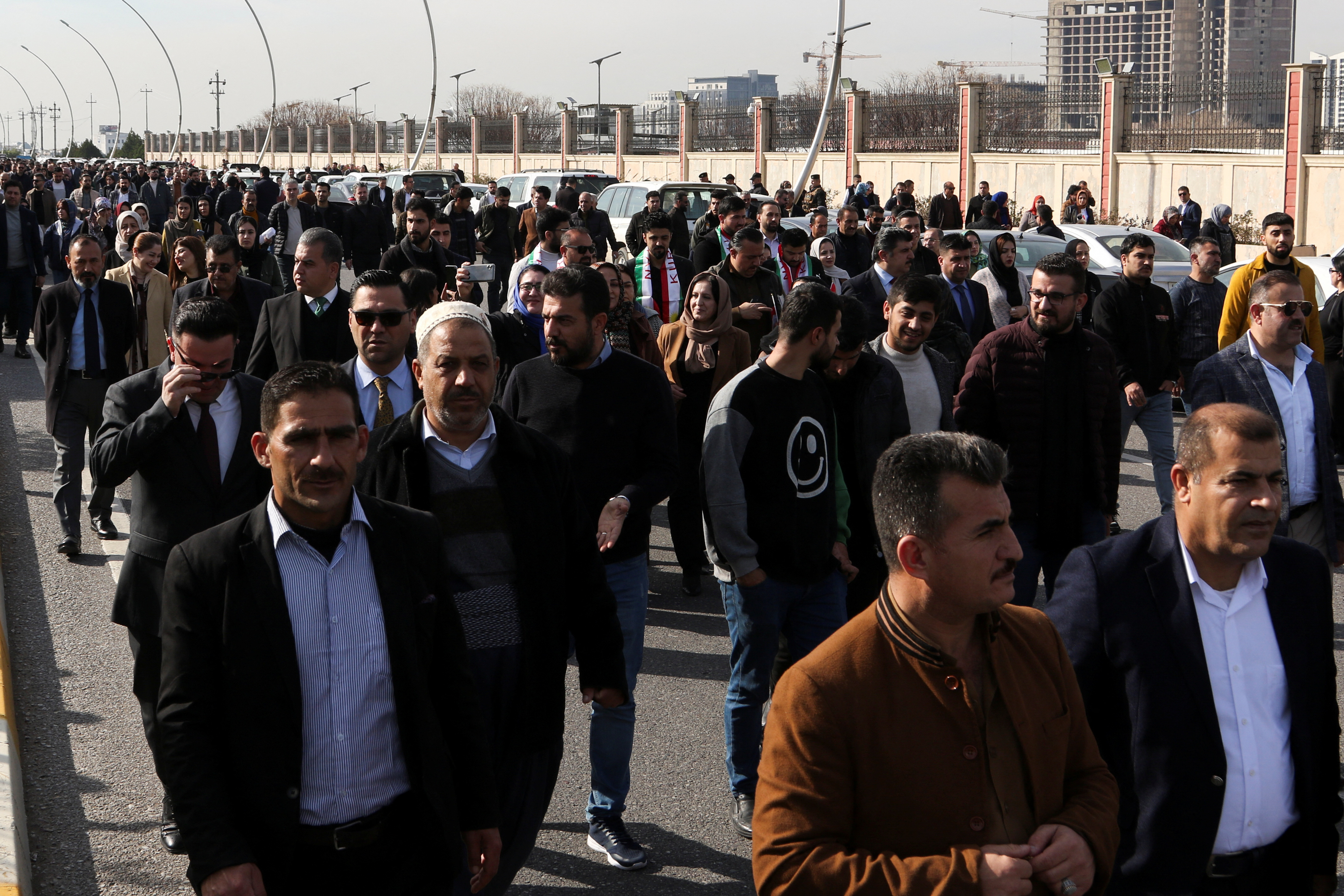 People demonstrate in front of the United Nations headquarters in Erbil