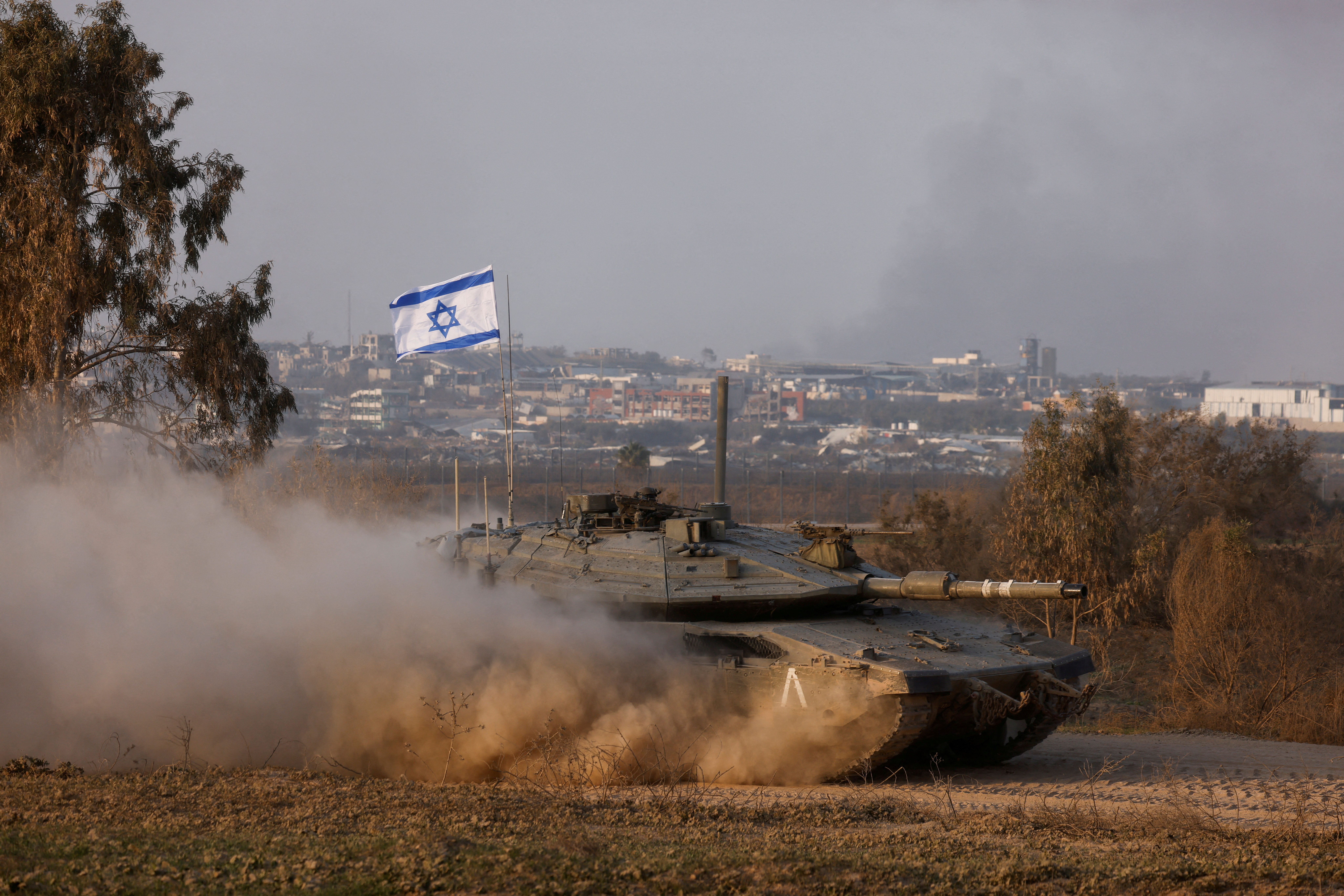 An Israeli tank operates, near the Israel-Gaza border, in Israel
